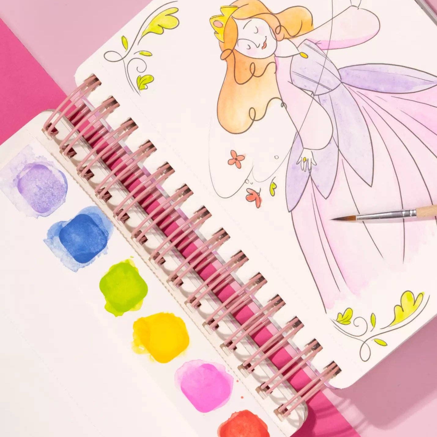 Colorful paint swatches with a fairy illustration on a pink background