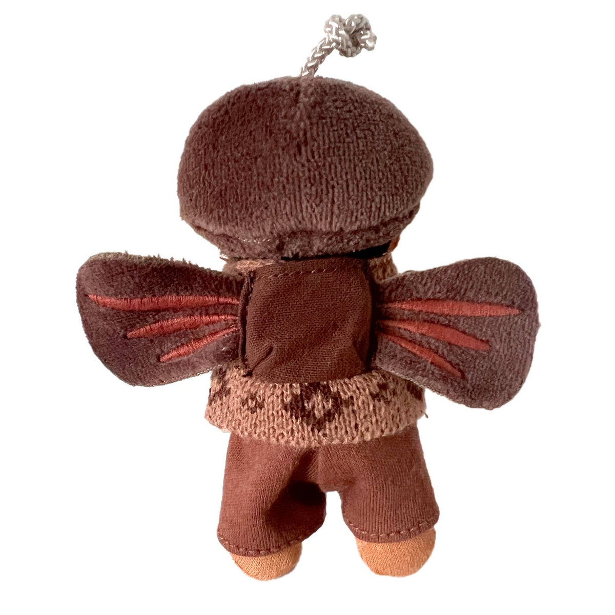 Brown plush toy with a hood and ears on a white background