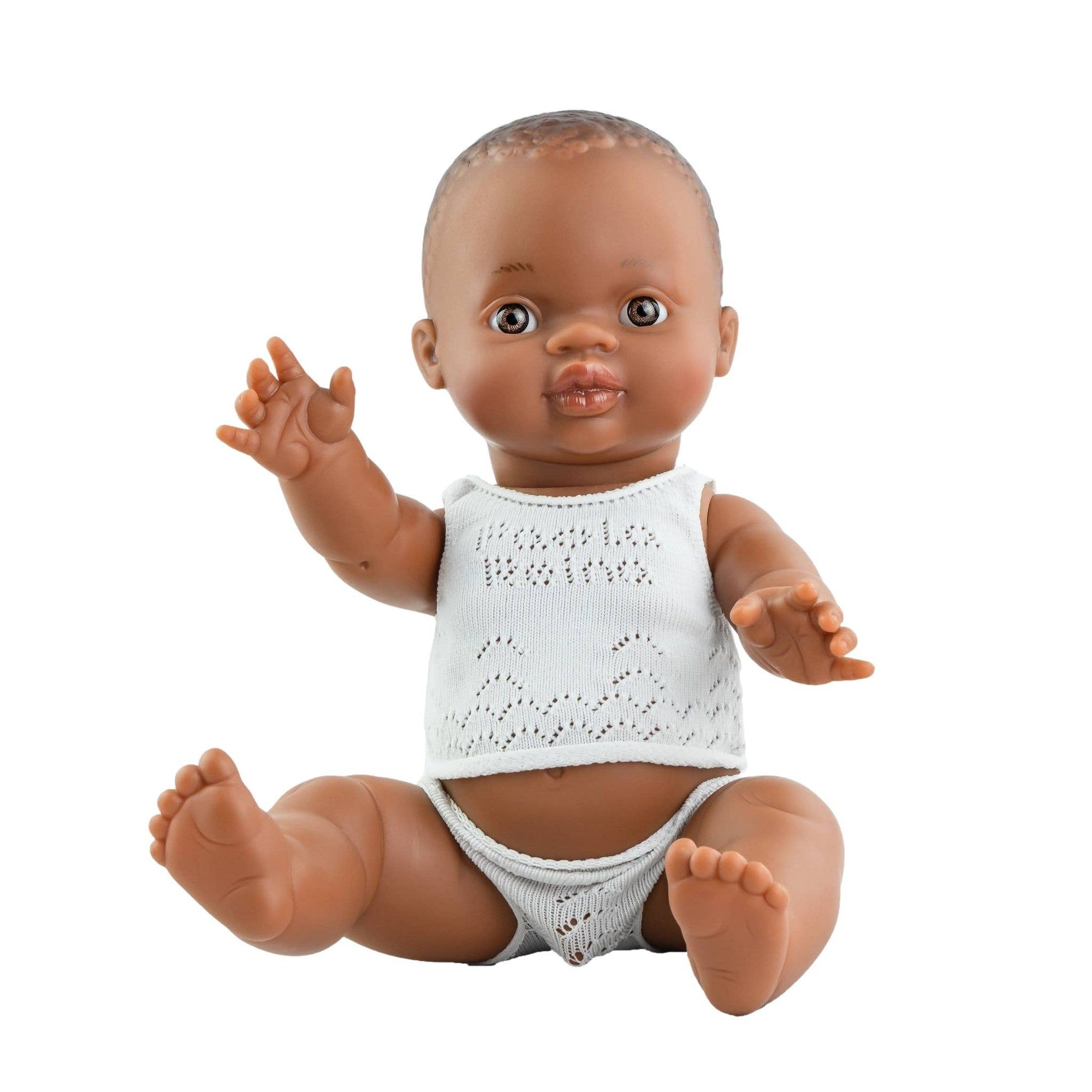 Baby doll with a white outfit on a white background