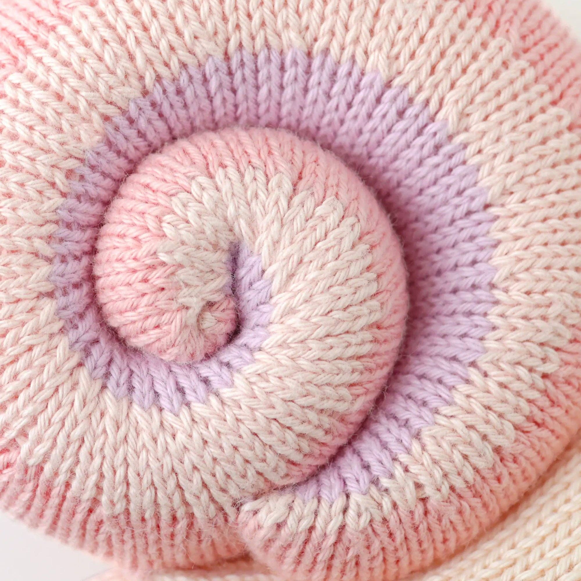 Close-up of pink and purple yarn skein