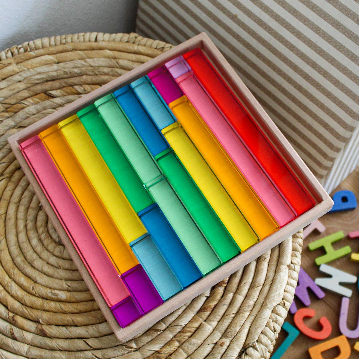 Colorful wooden blocks and magnetic letters on a wooden surface