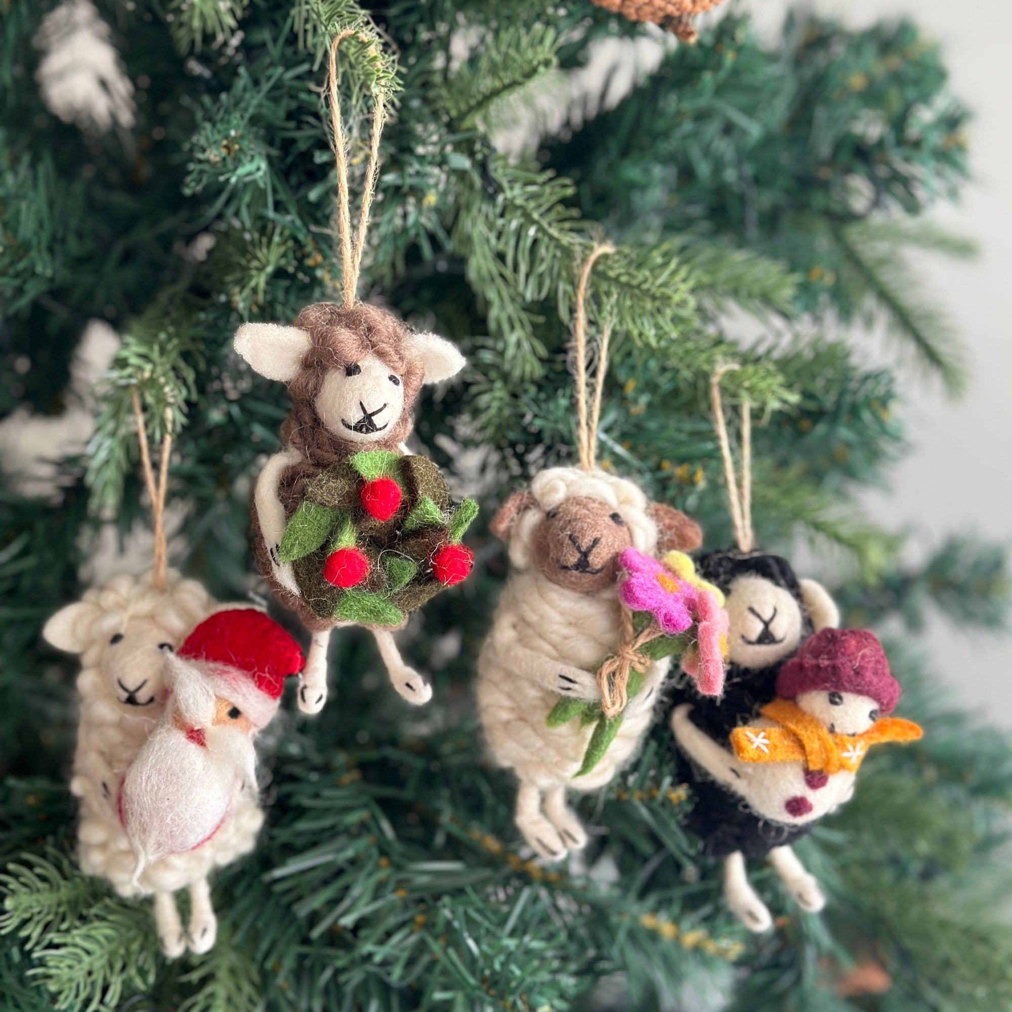 Decorative sheep ornaments on a Christmas tree