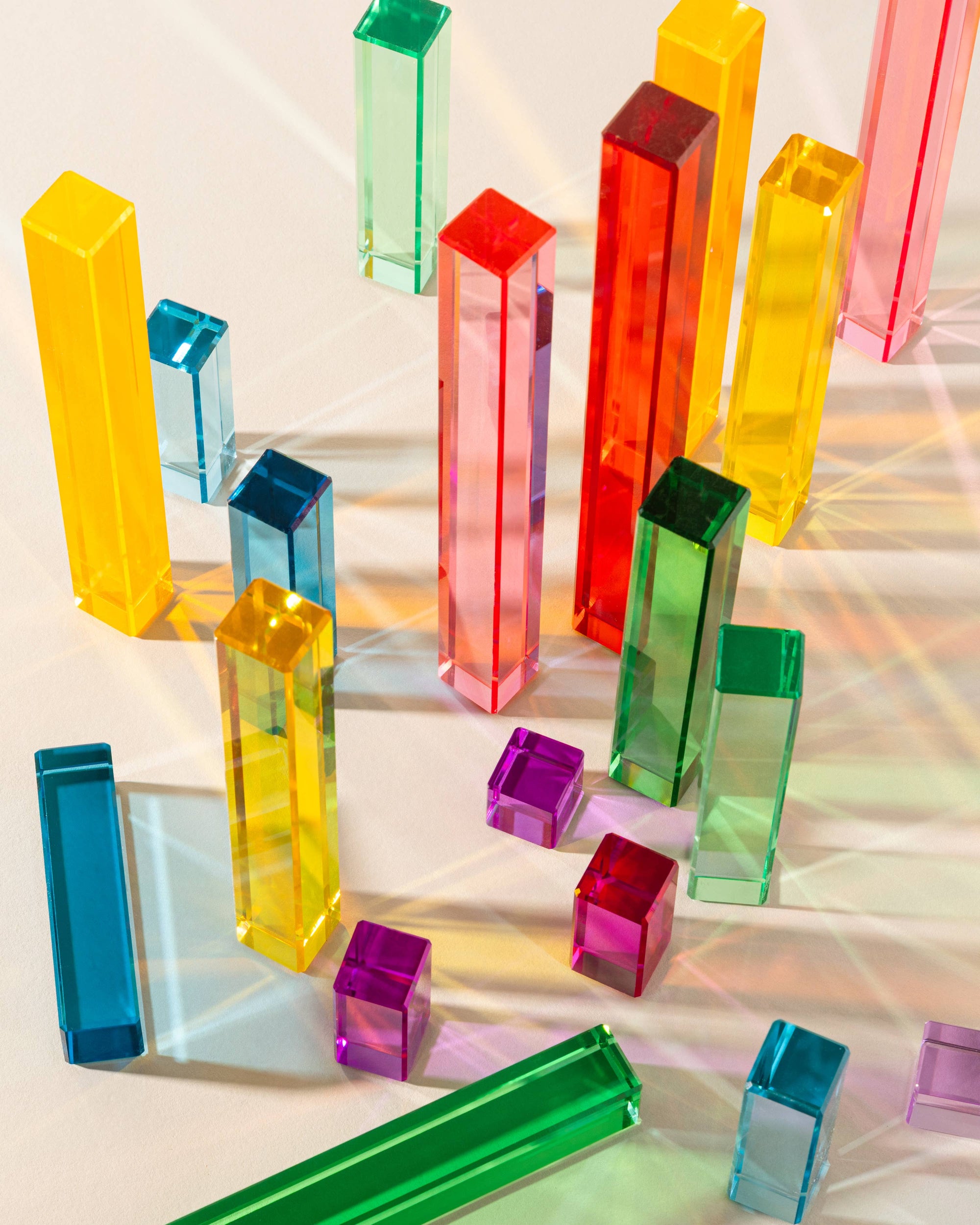 Colorful transparent geometric blocks on a reflective surface