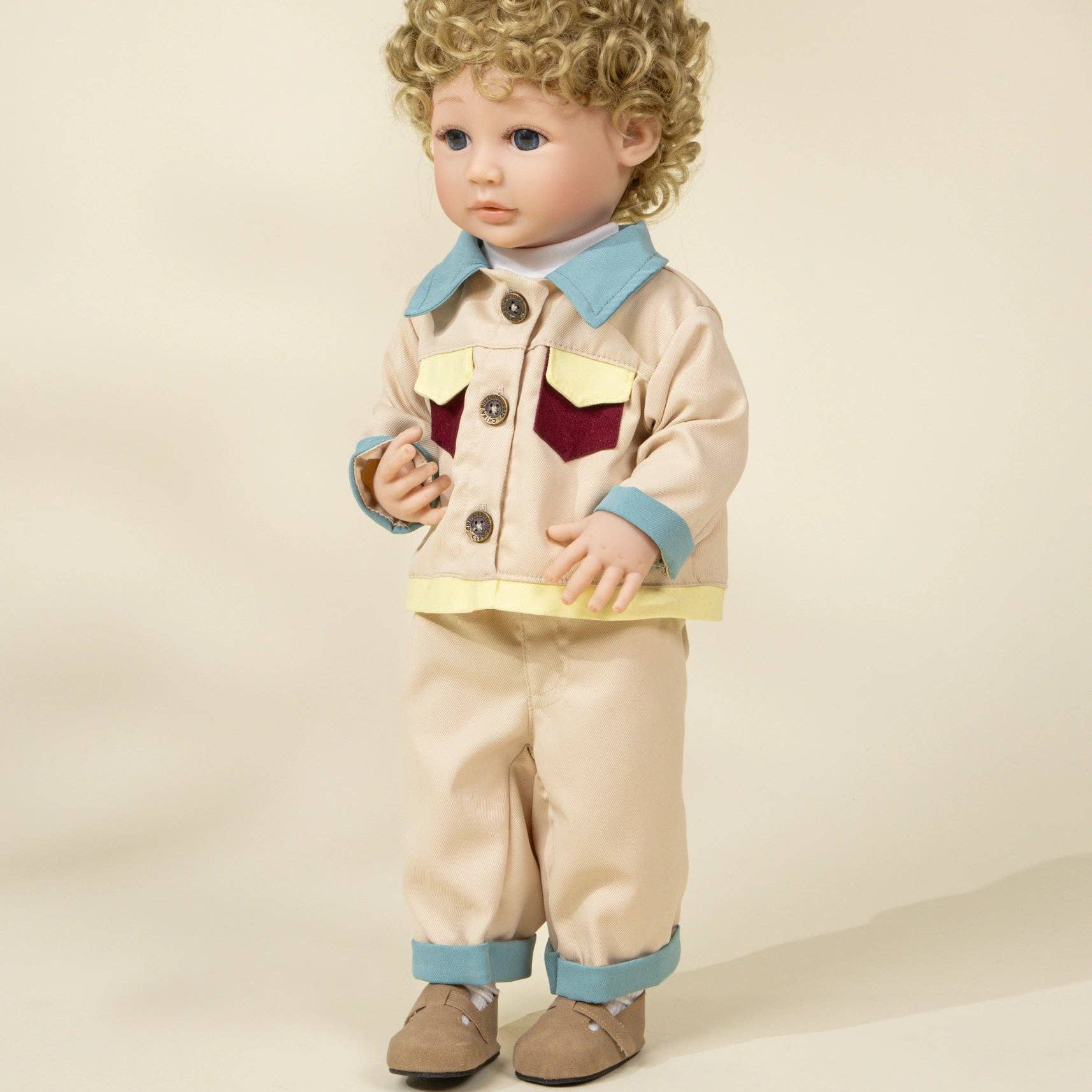 Doll wearing a beige outfit with a red heart on a beige background