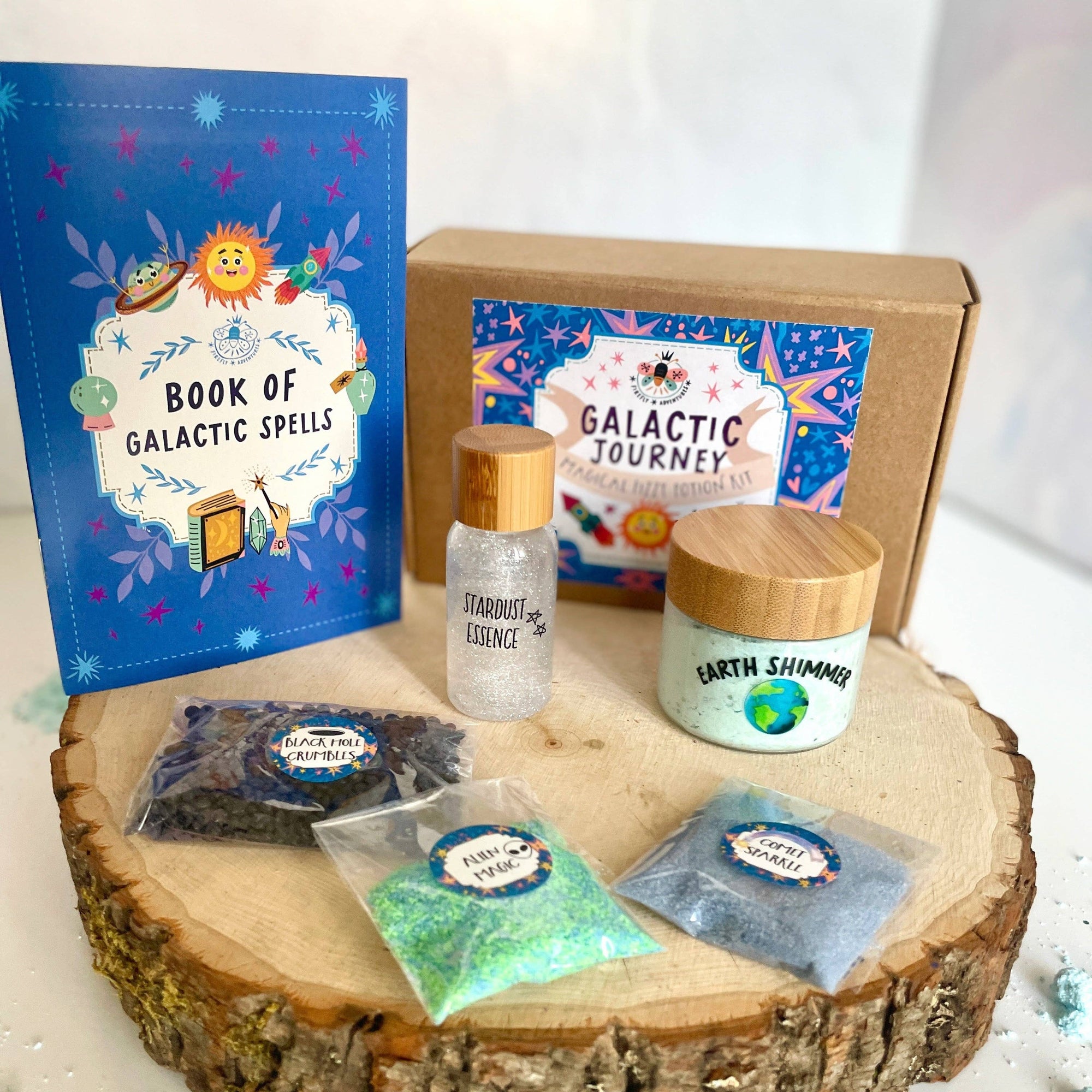Cosmetic set with 'Book of Galactic Spells' and various items on a wooden platform.