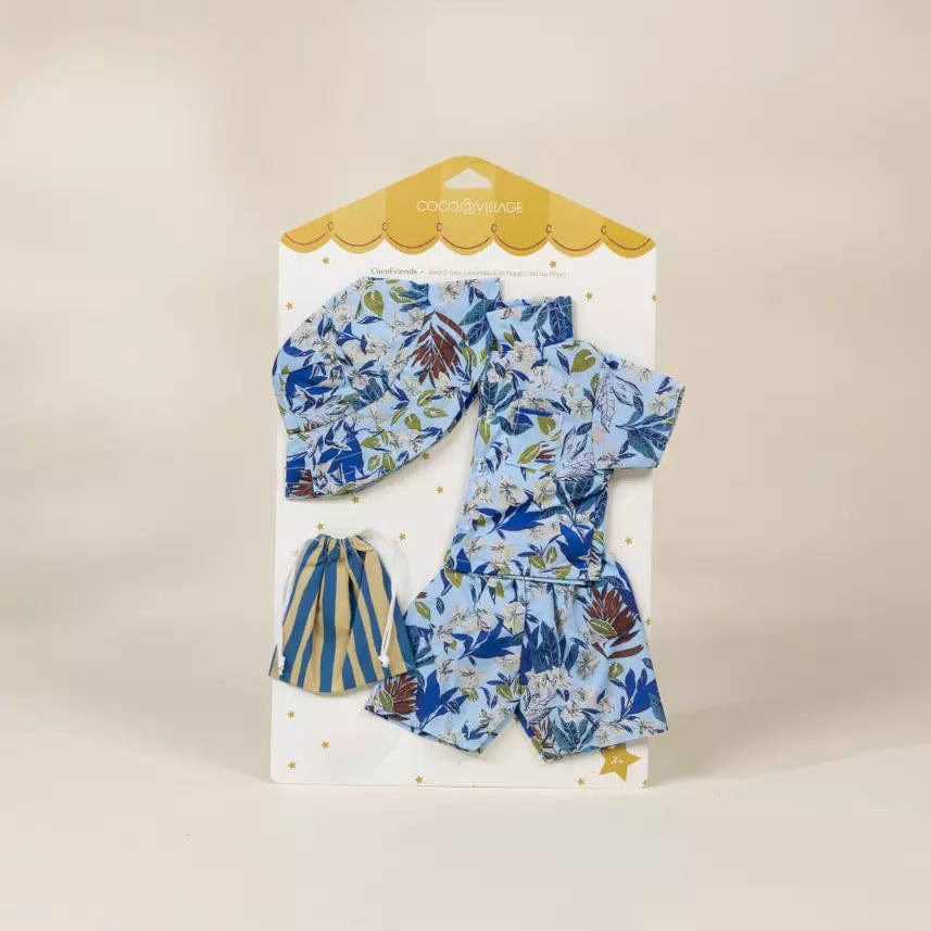 Packaged doll outfit with floral and striped design on a beige background