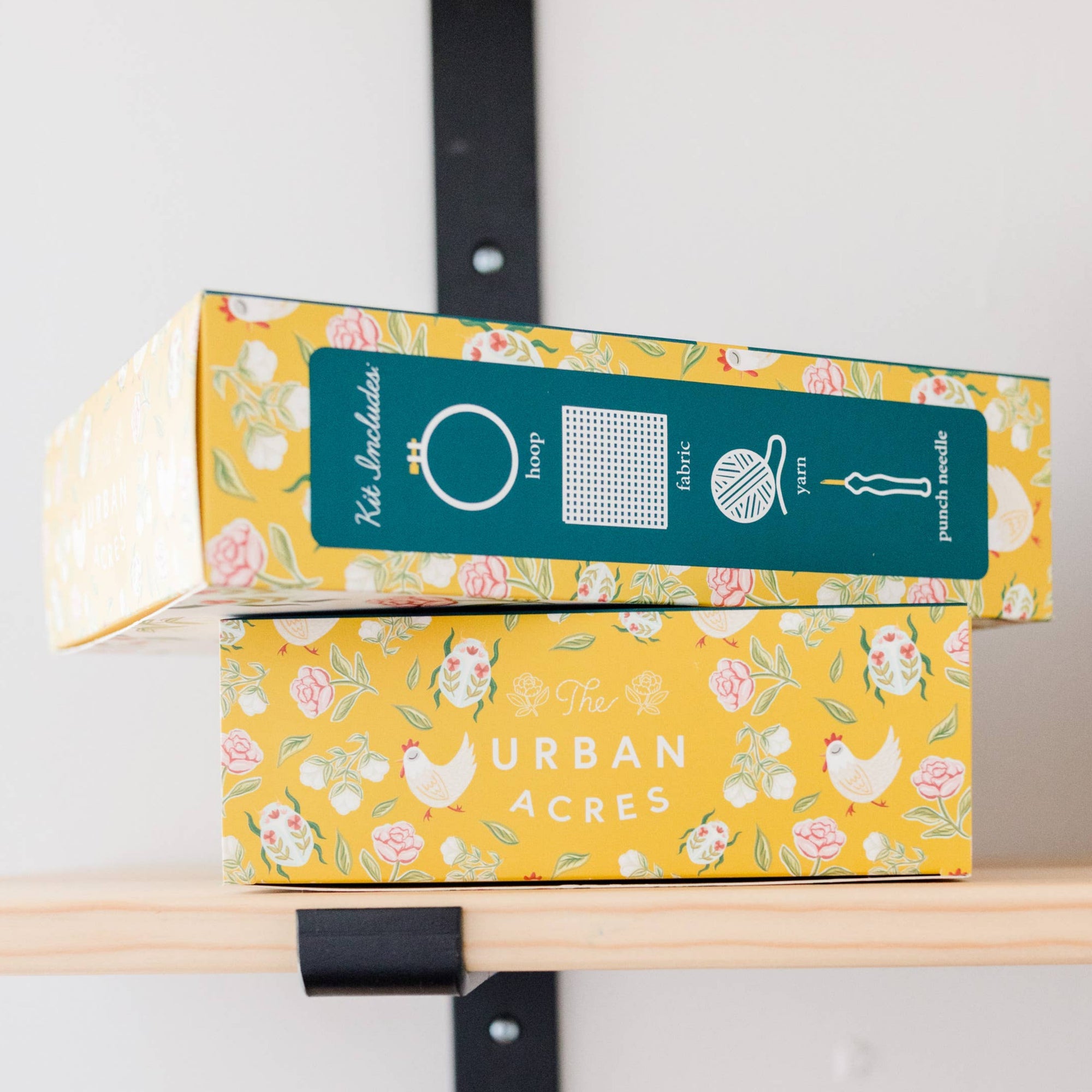 Colorful boxes with 'Urban Acres' branding on a shelf.