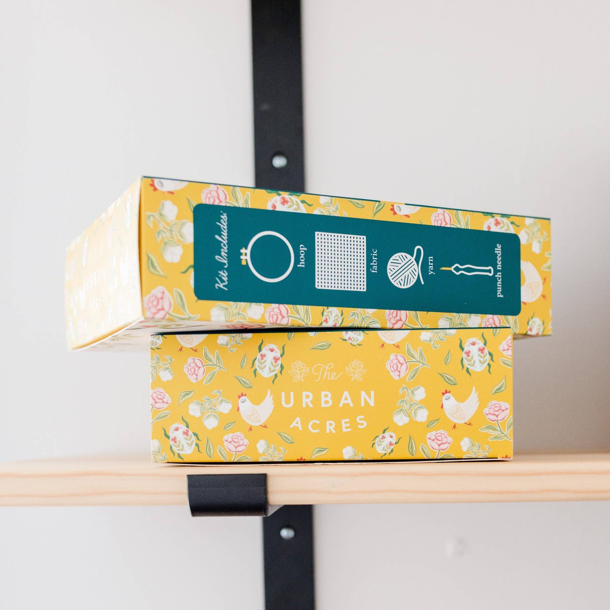Colorful boxes with 'Urban Acres' branding on a shelf.