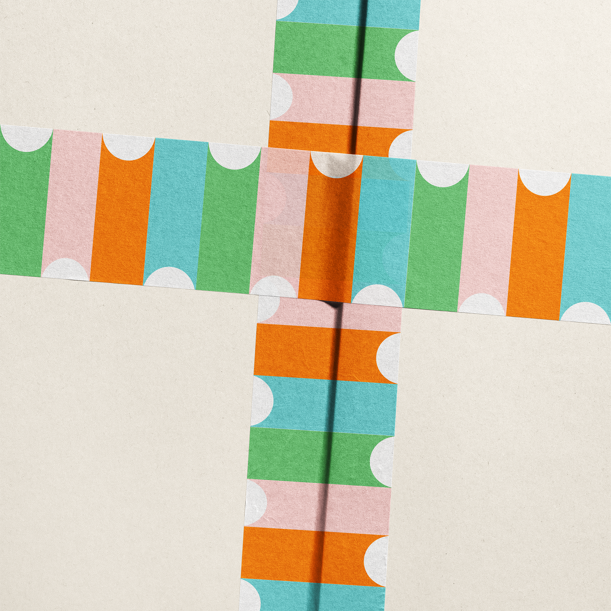 Colorful patterned paper with geometric shapes on a beige background