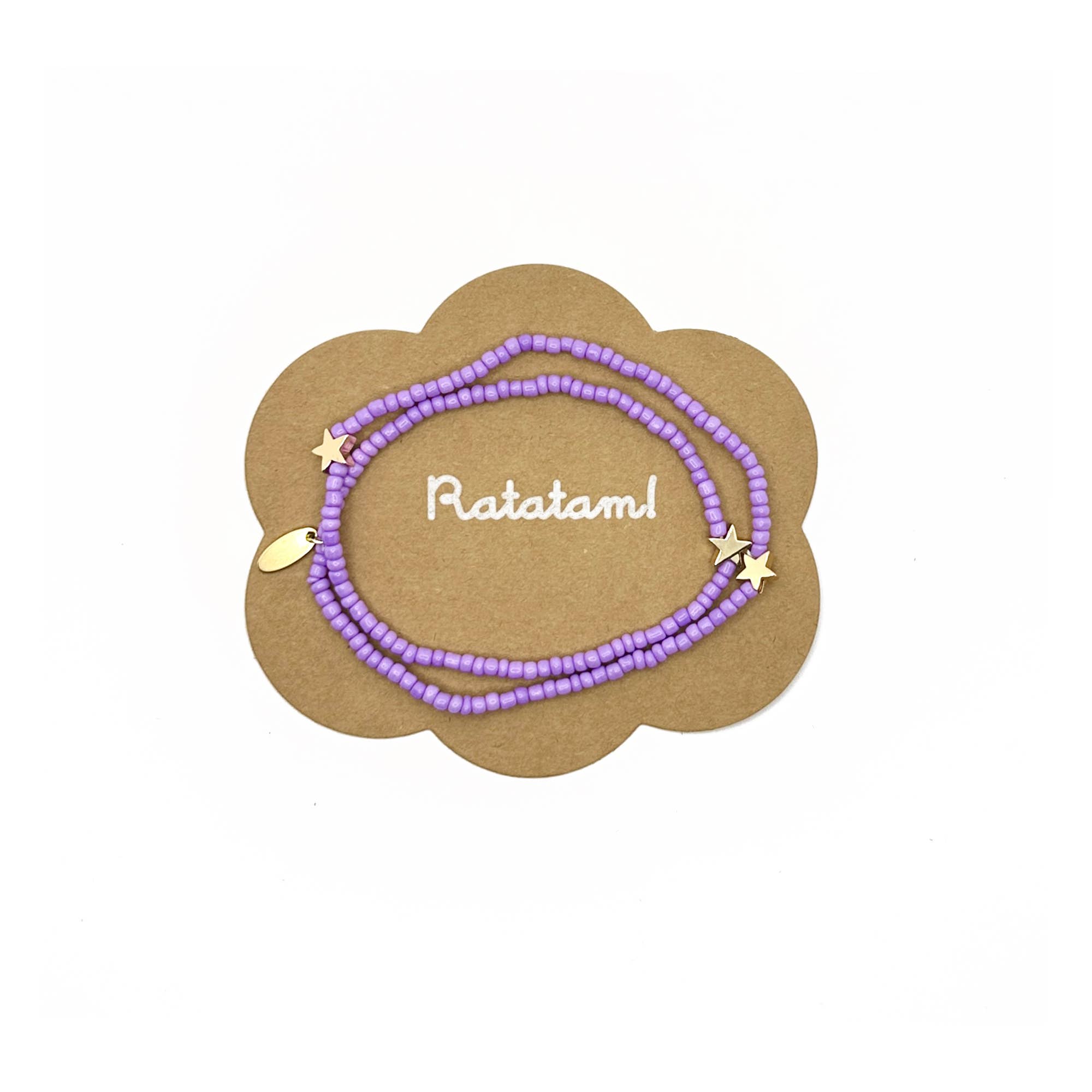 Purple beaded necklace with gold accents on a branded card