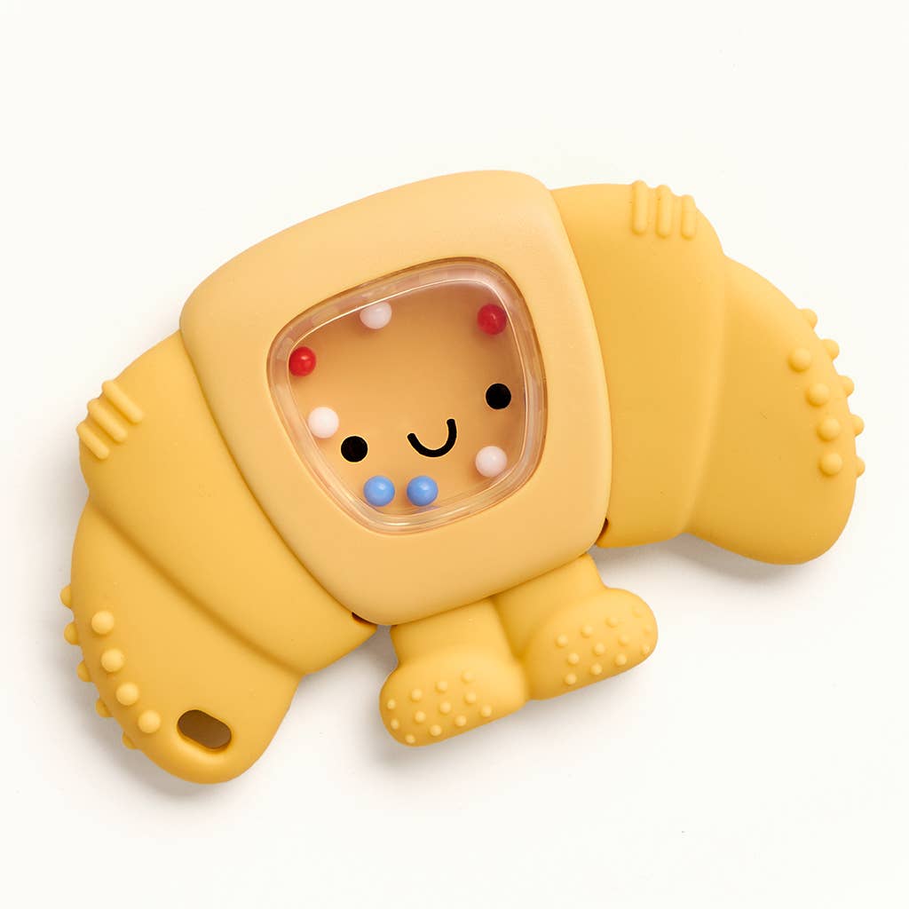 Yellow toy with a smiley face and colorful beads inside on a white background