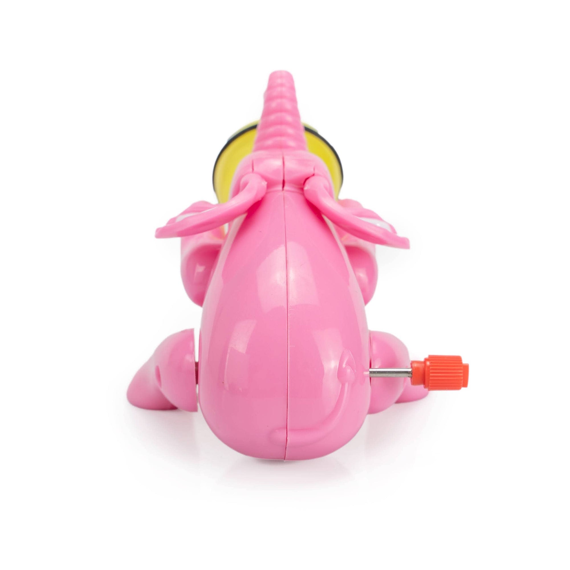 Pink toy with a yellow circle and red nozzle on a white background
