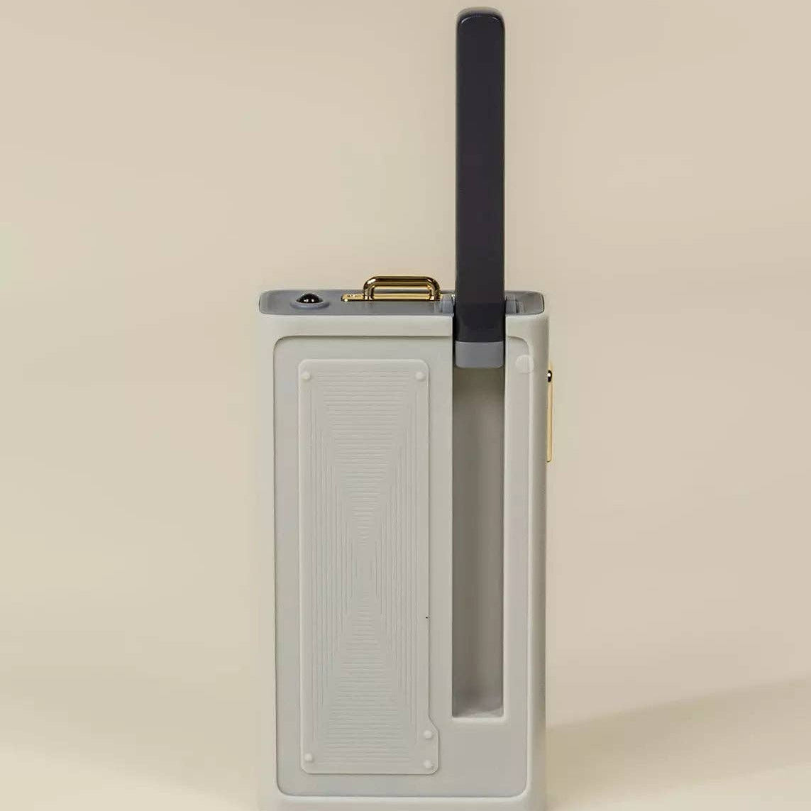 Rectangular electronic device with a antenna on a beige background