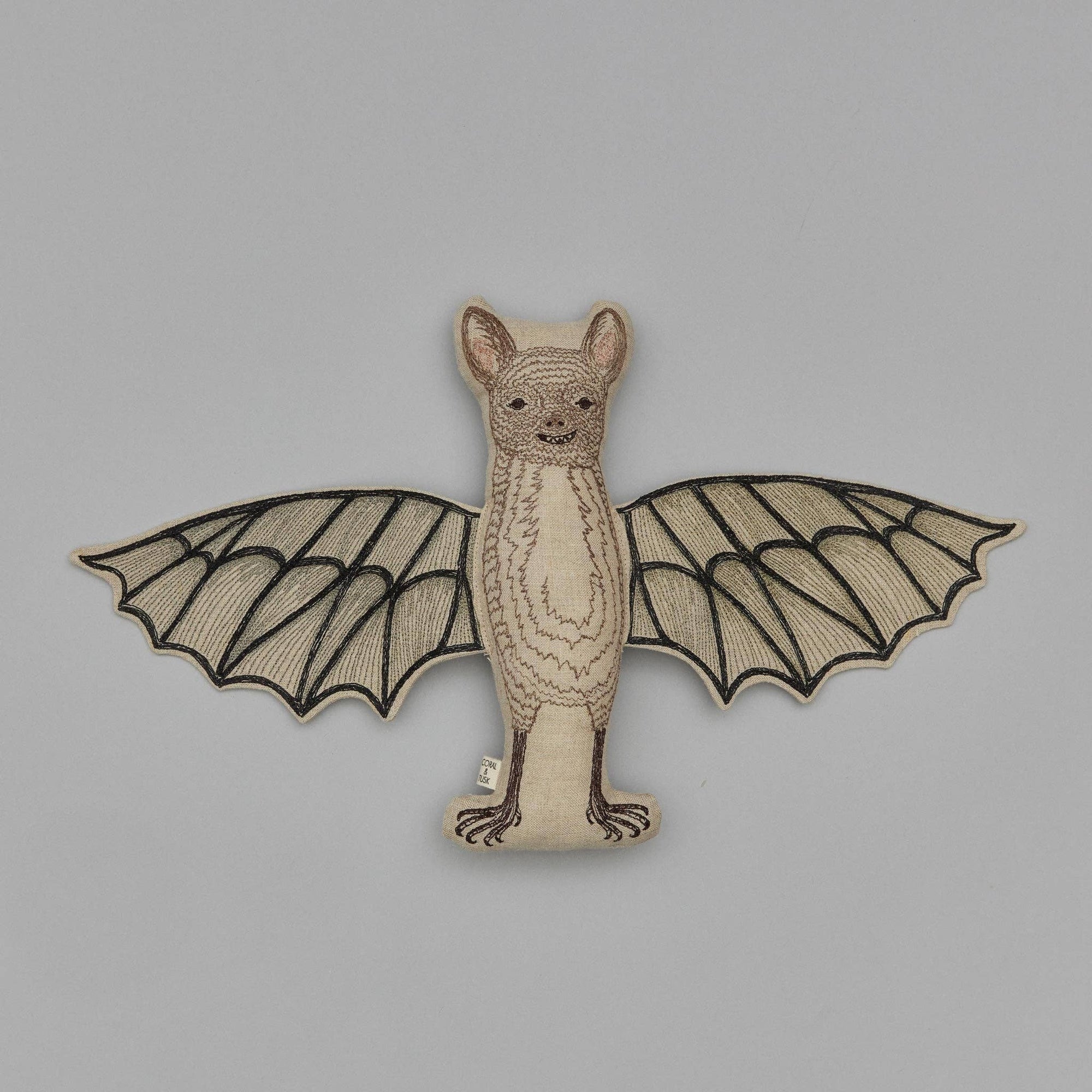 Embroidered bat design on a gray background
