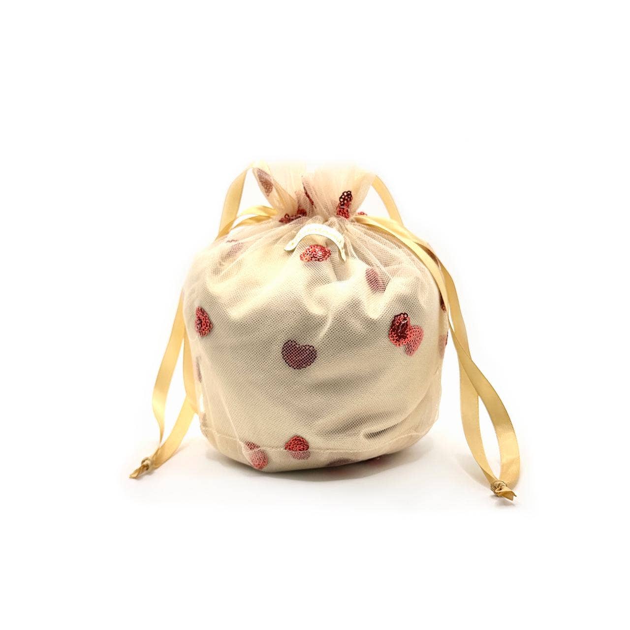 Beige drawstring bag with red heart patterns on a white background