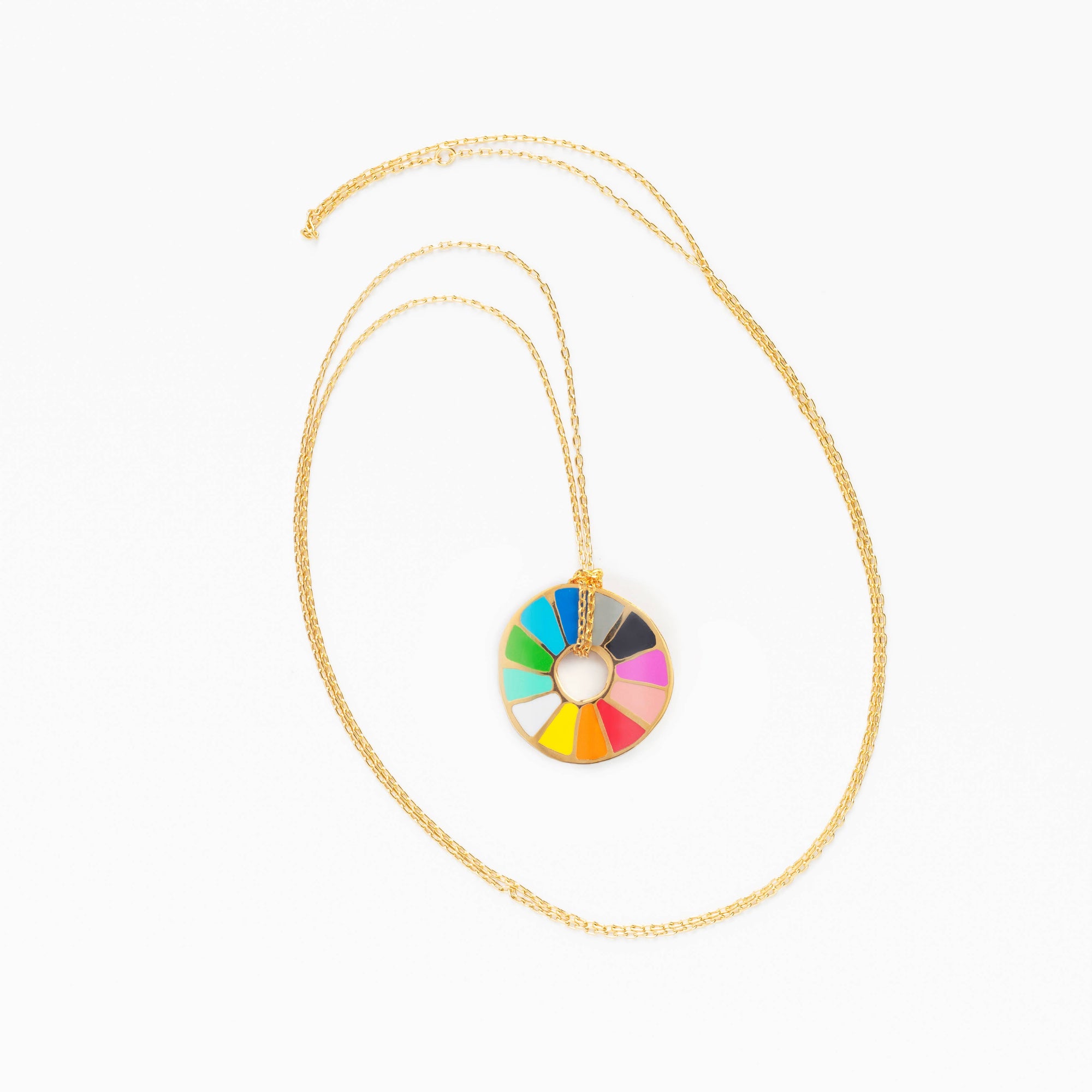 Necklace with a colorful circular pendant on a white background