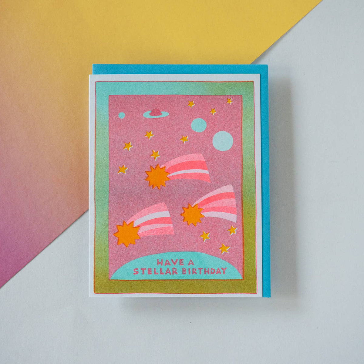 Greeting card with space-themed design and 'Have a Stellar Birthday' text on a colorful background