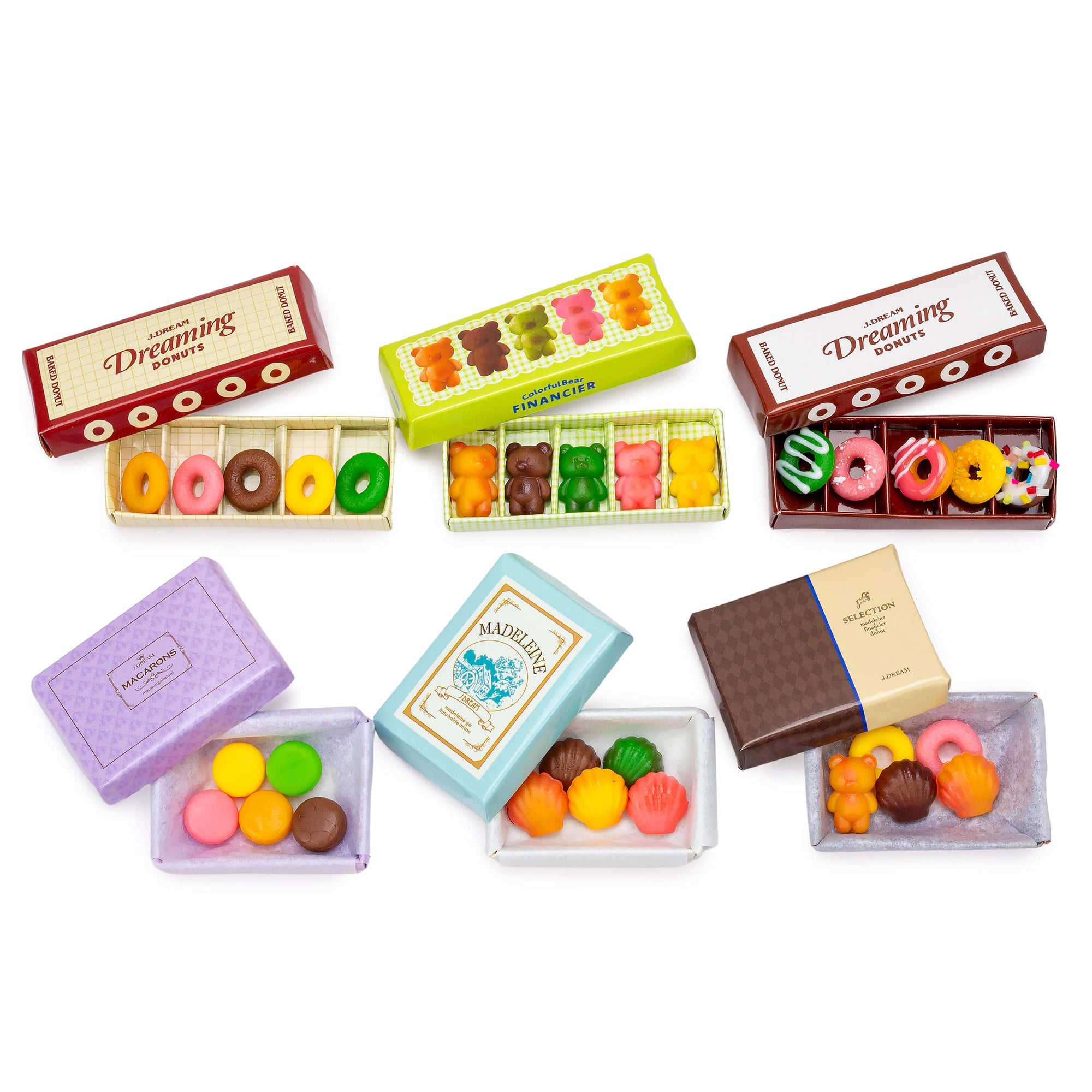 Assorted colorful candy boxes on a white background