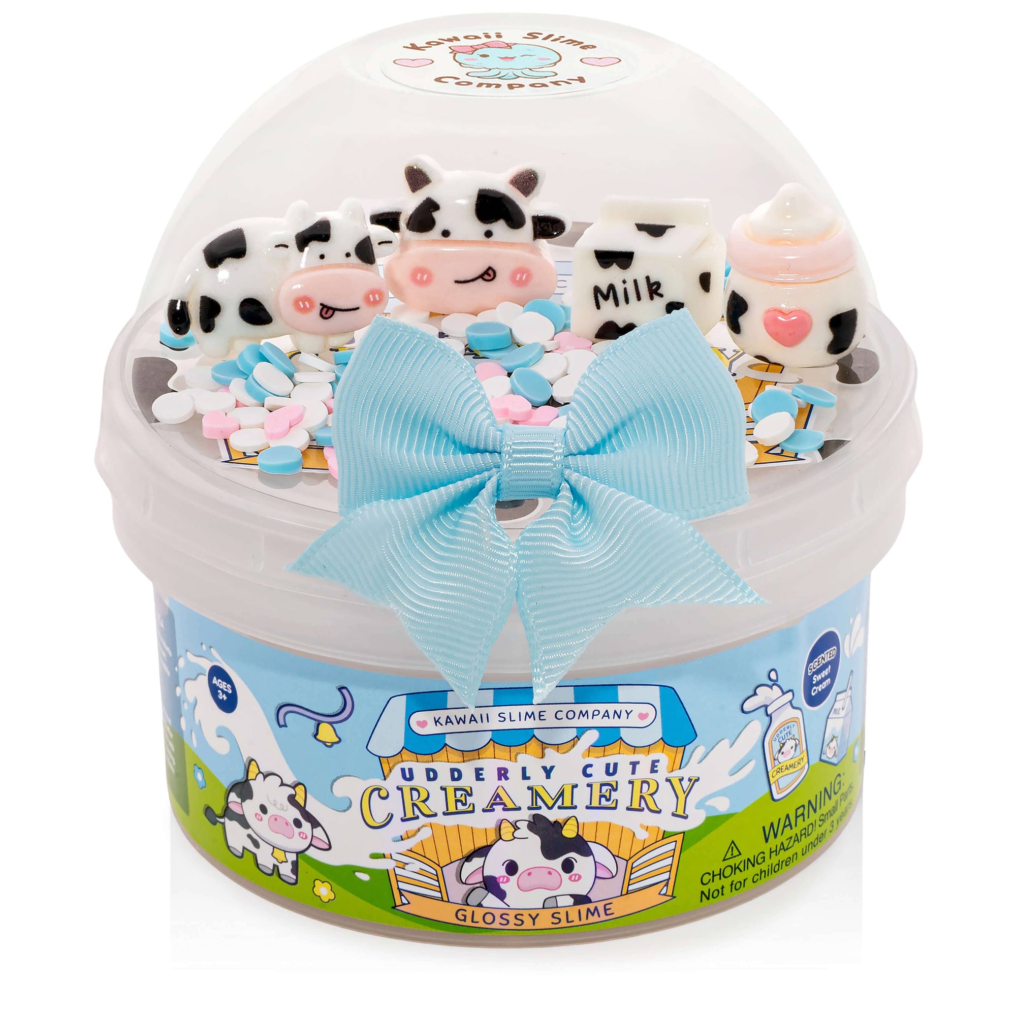 Glossy slime product with cow-themed decorations and a blue bow, branded 'Kawaii Slime Company'.
