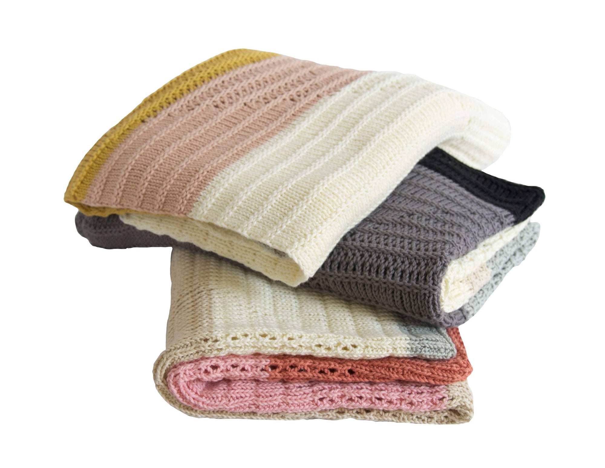 Stack of colorful knitted blankets on a white background