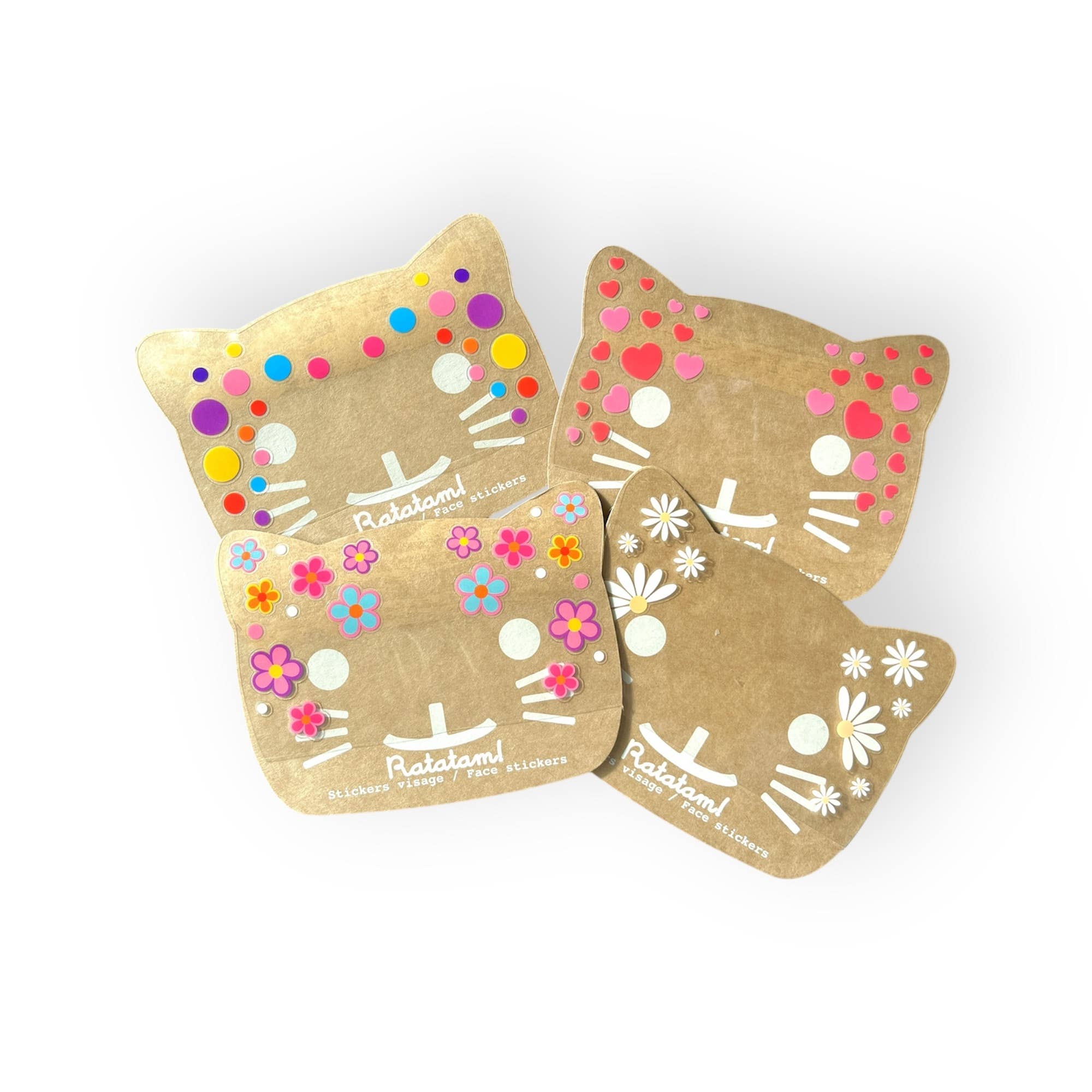Three cat-shaped face masks with decorative patterns on a white background