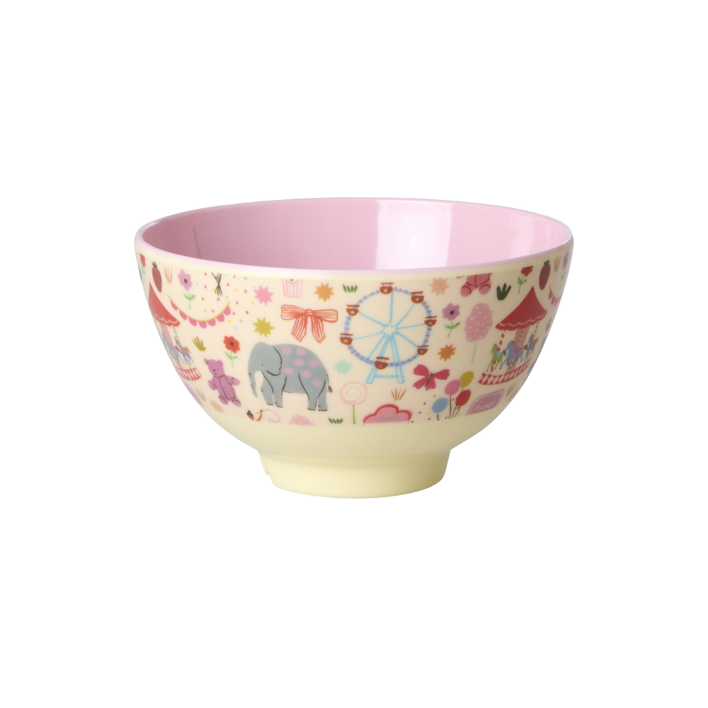 Colorful children's bowl with animal and fairground design on a white background