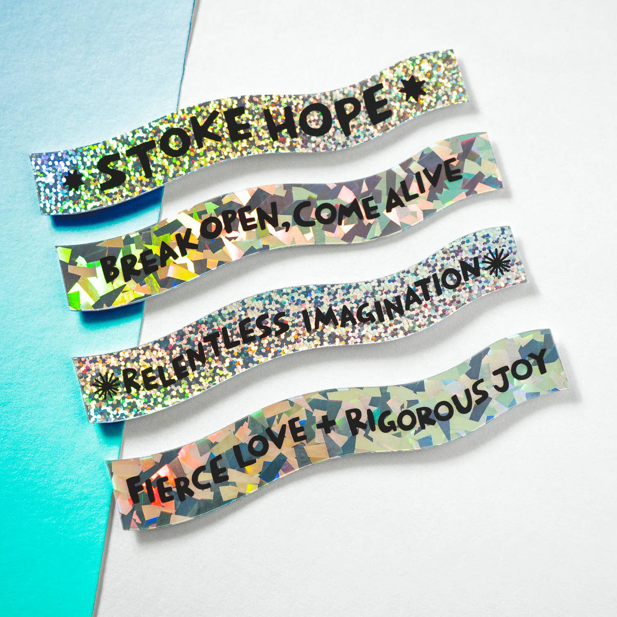 Colorful wristbands with motivational phrases on a gradient background