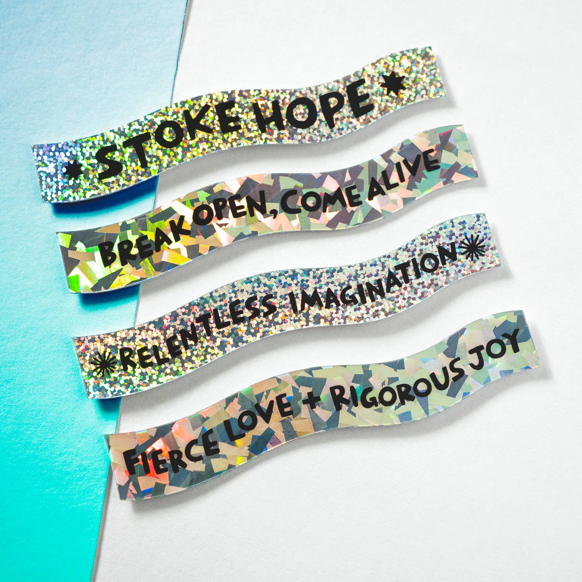 Colorful wristbands with motivational phrases on a gradient background