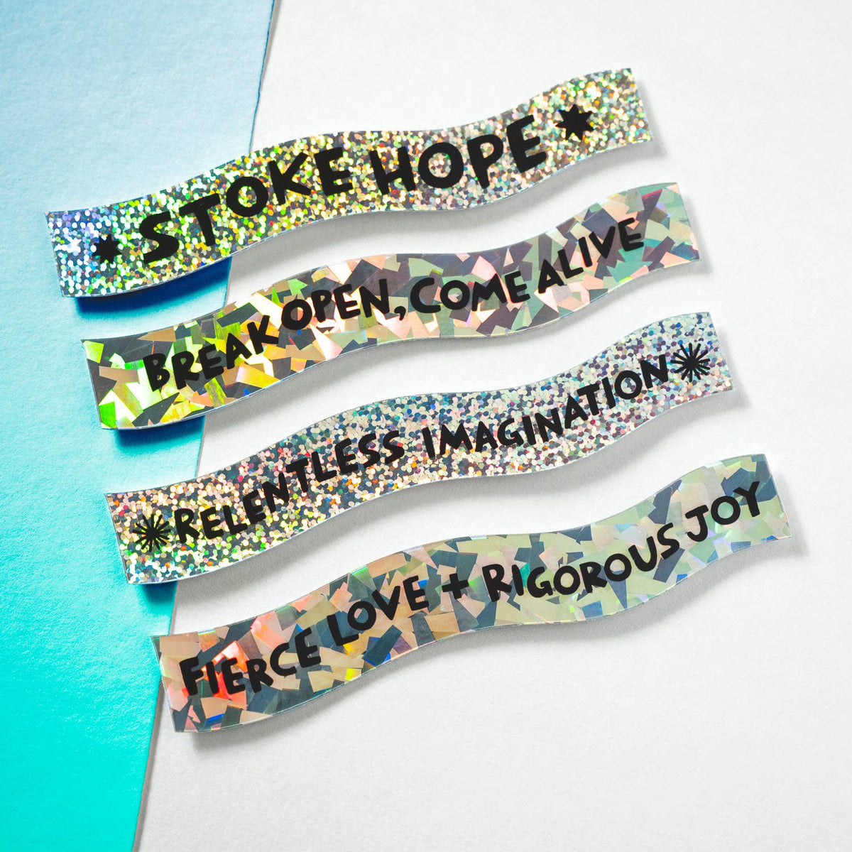 Colorful wristbands with motivational phrases on a gradient background