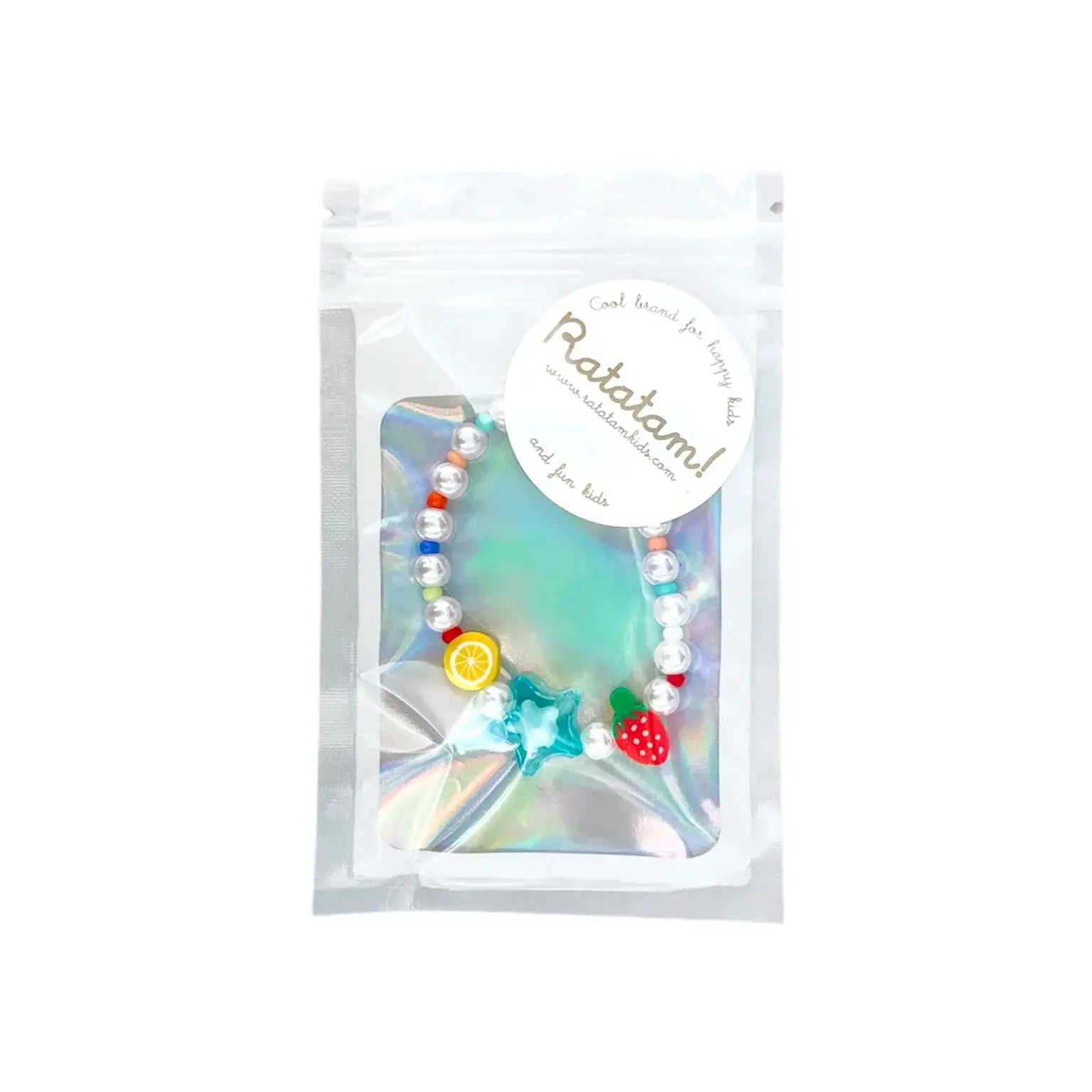 Colorful bracelet with star and fruit charms in packaging labeled 'Ratatam'.