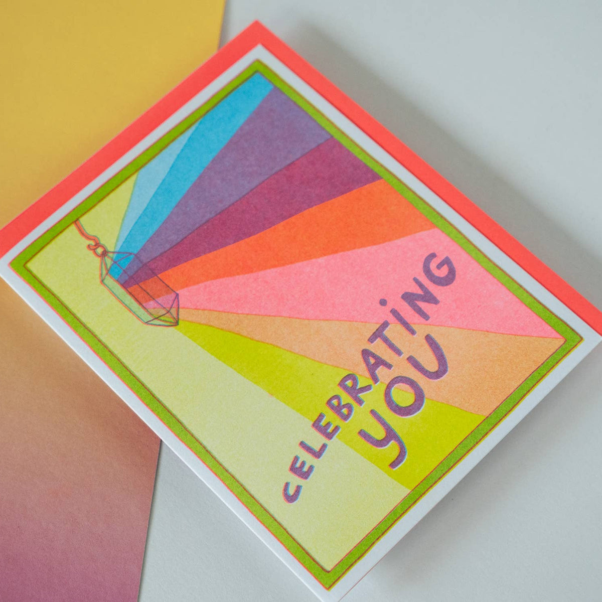Colorful card with a hot air balloon design and 'Celebrating You' text on a gradient background.