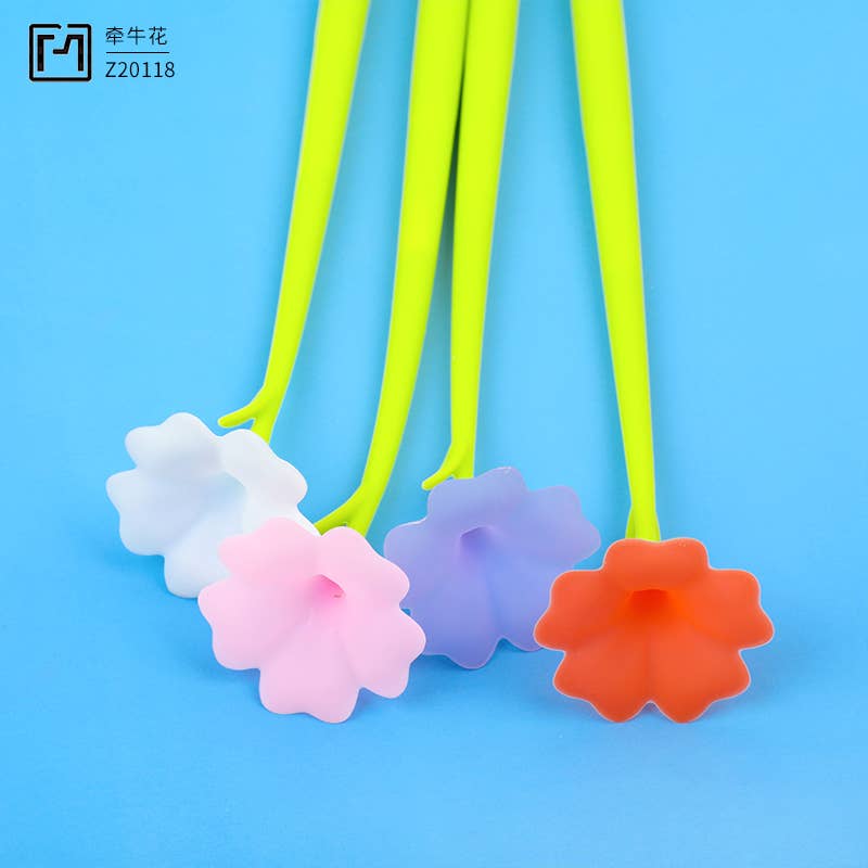 Colorful flower-shaped bottle stoppers on a blue background