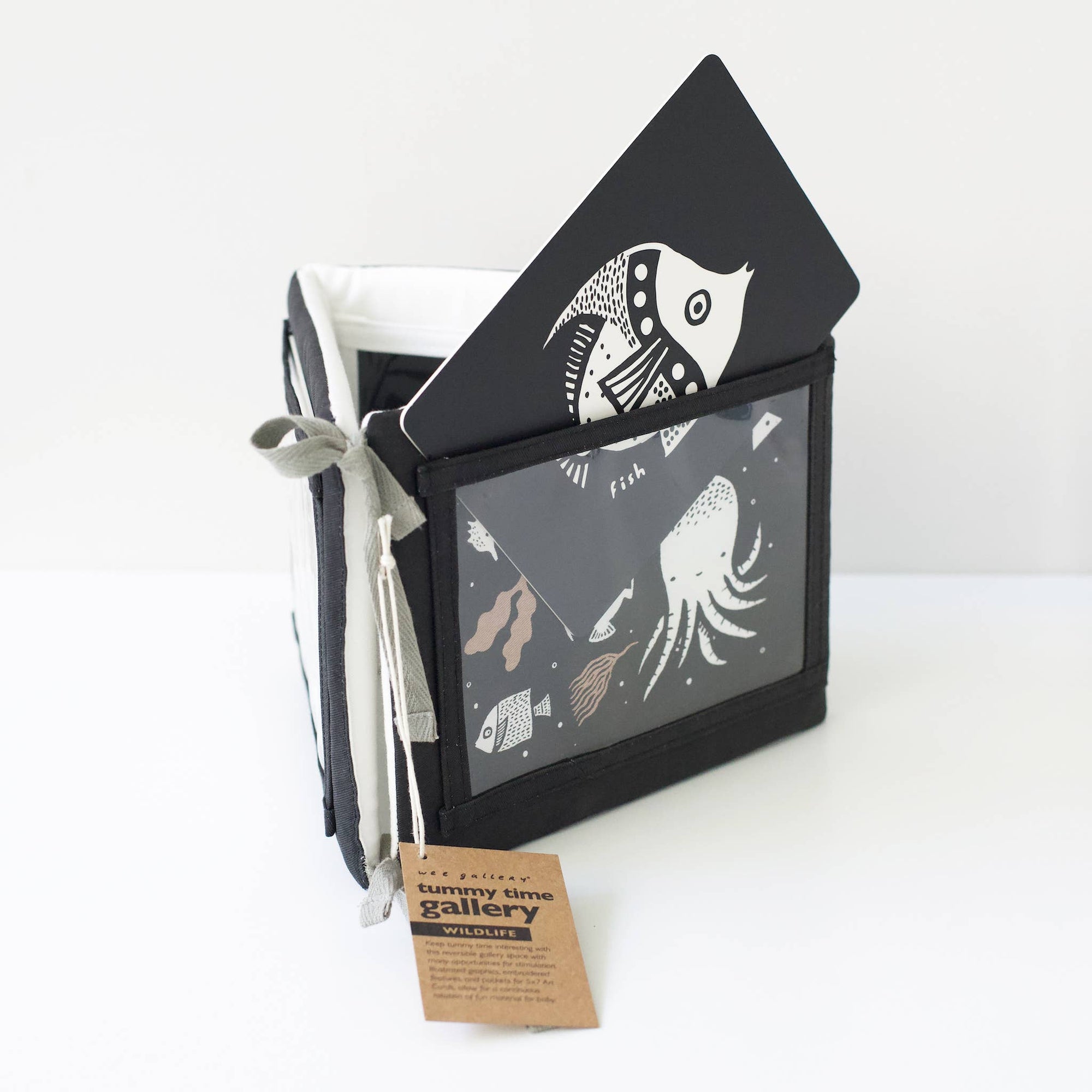 Packaging with black and white illustrations of marine life on a white background