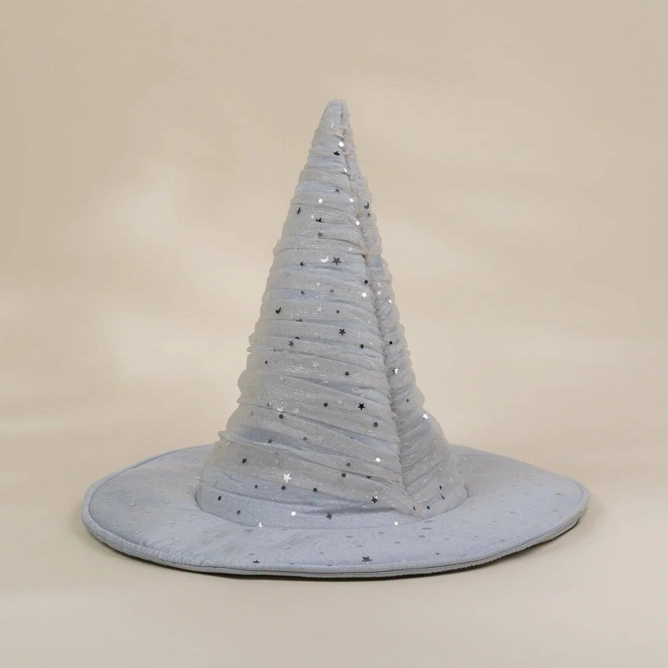 A light blue fabric witch hat with silver glitter trim, displayed on a neutral beige background.