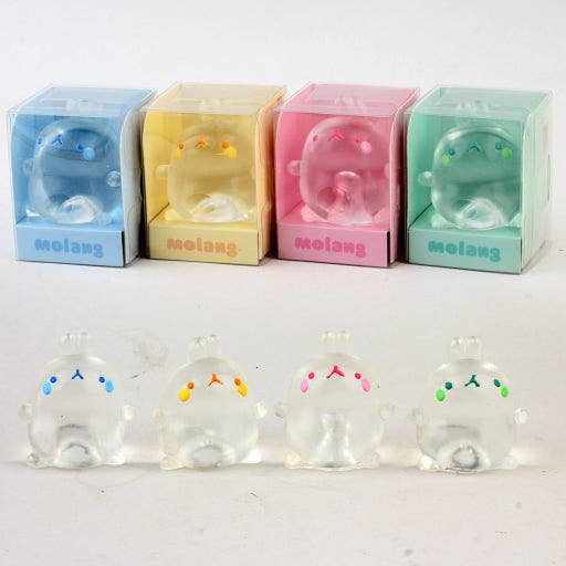 Set of small transparent figurines with colorful facial expressions in front of their colored boxes on a white background.