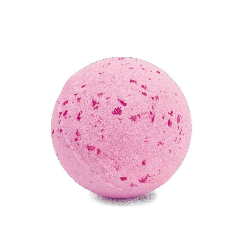 Pink bath bomb with speckles on a white background