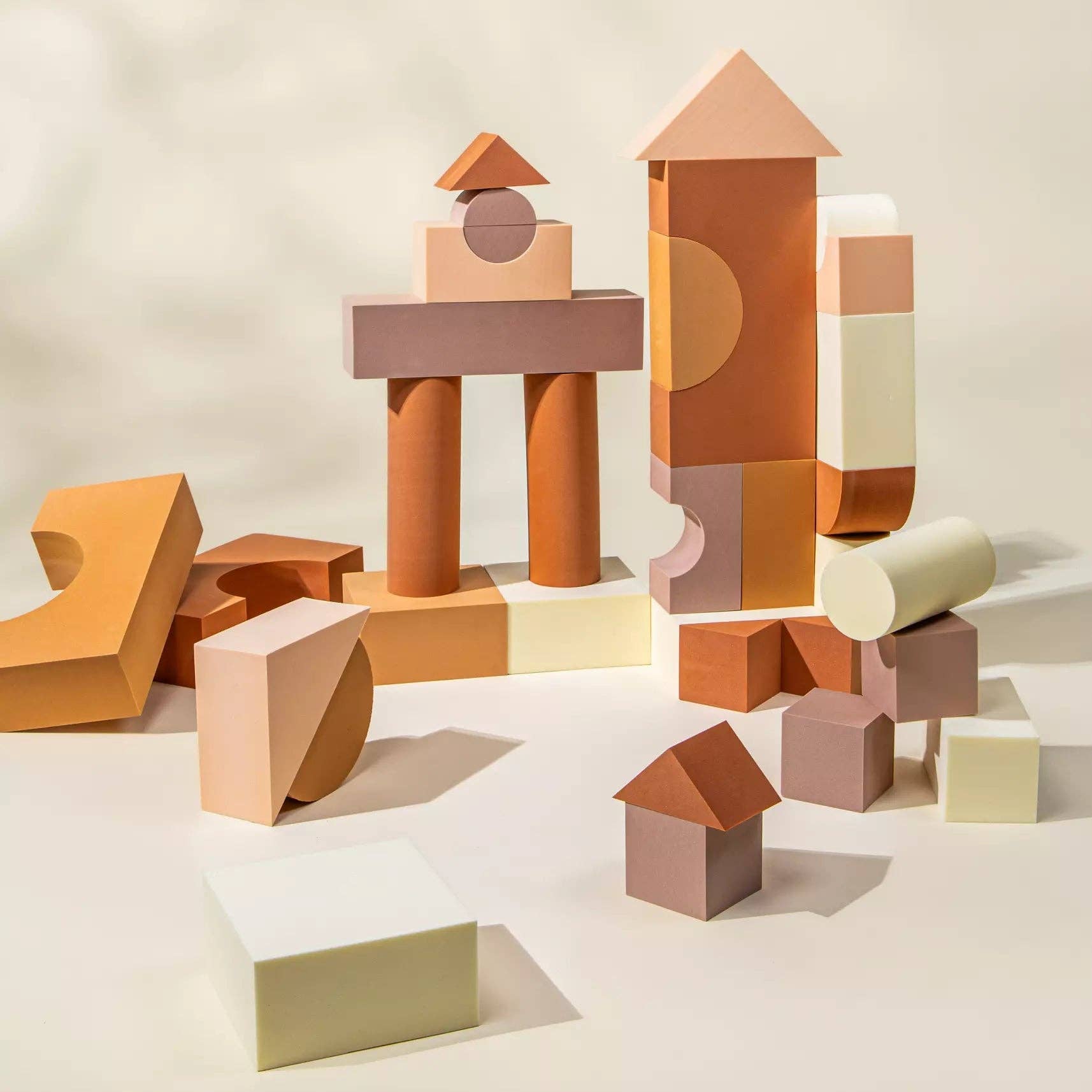 Colorful geometric blocks arranged on a light background