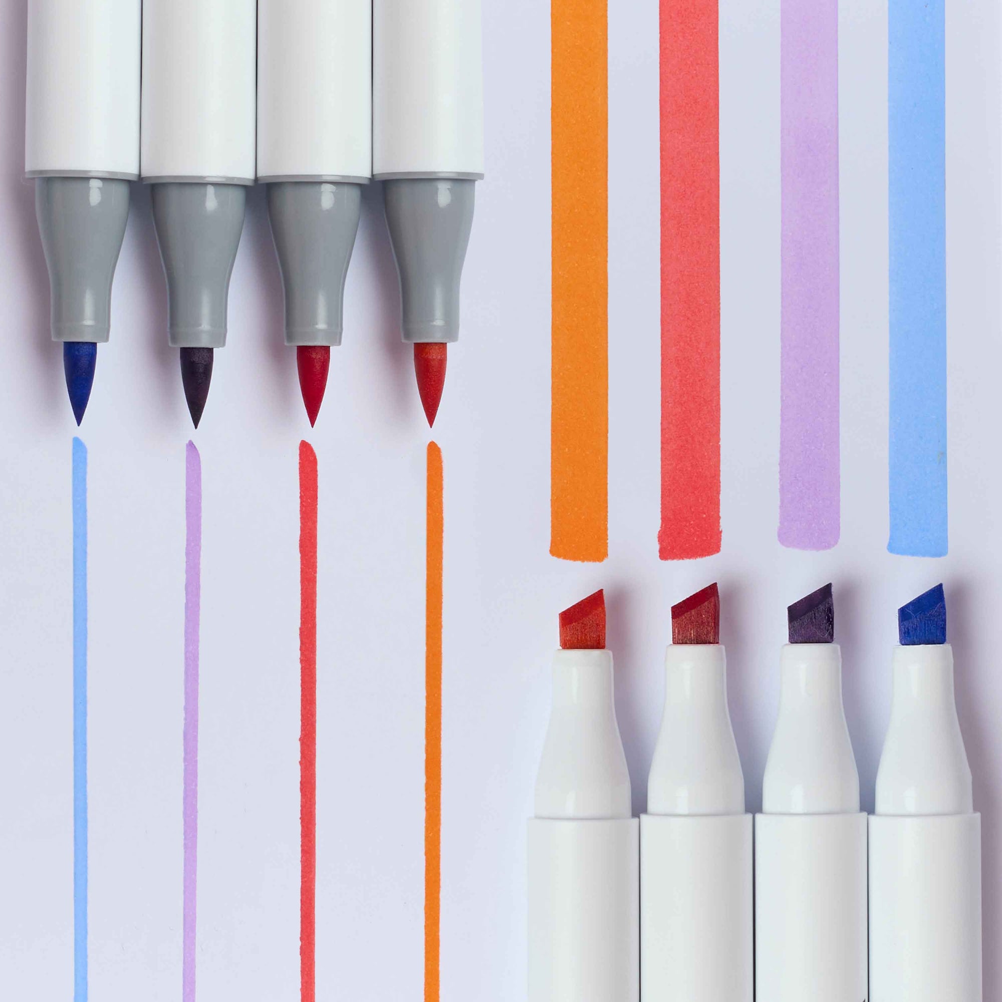 Six dual-tip markers arranged vertically on a white background, with colored ink strokes shown beside and below the tips. The visible ink colors include blue, lavender, red, and orange, with the markers themselves in white, gray, and red.
