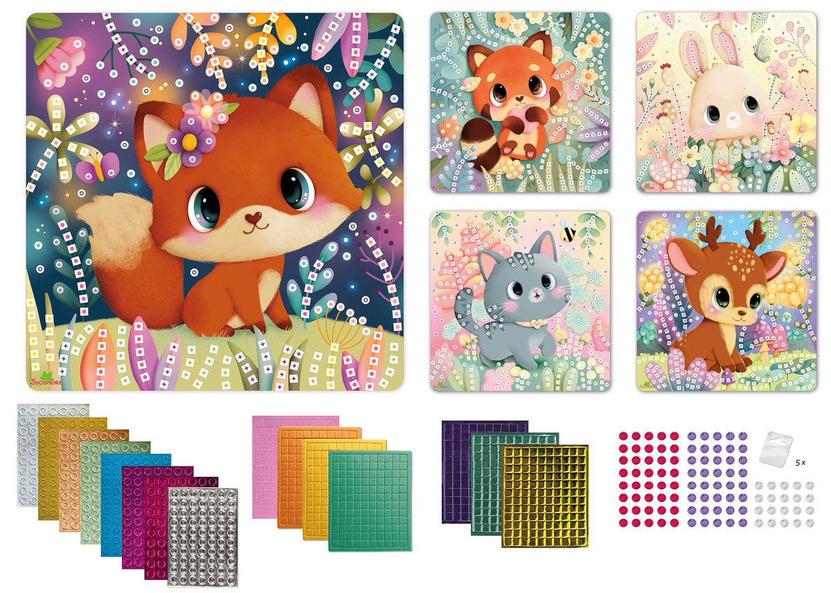 A children's craft or art kit shown on a white background, featuring a large illustrated canvas with a cartoon fox, four smaller animal illustrations, sheets of colorful stickers, patterned sheets, and small red/blue/purple dots on a white surface.