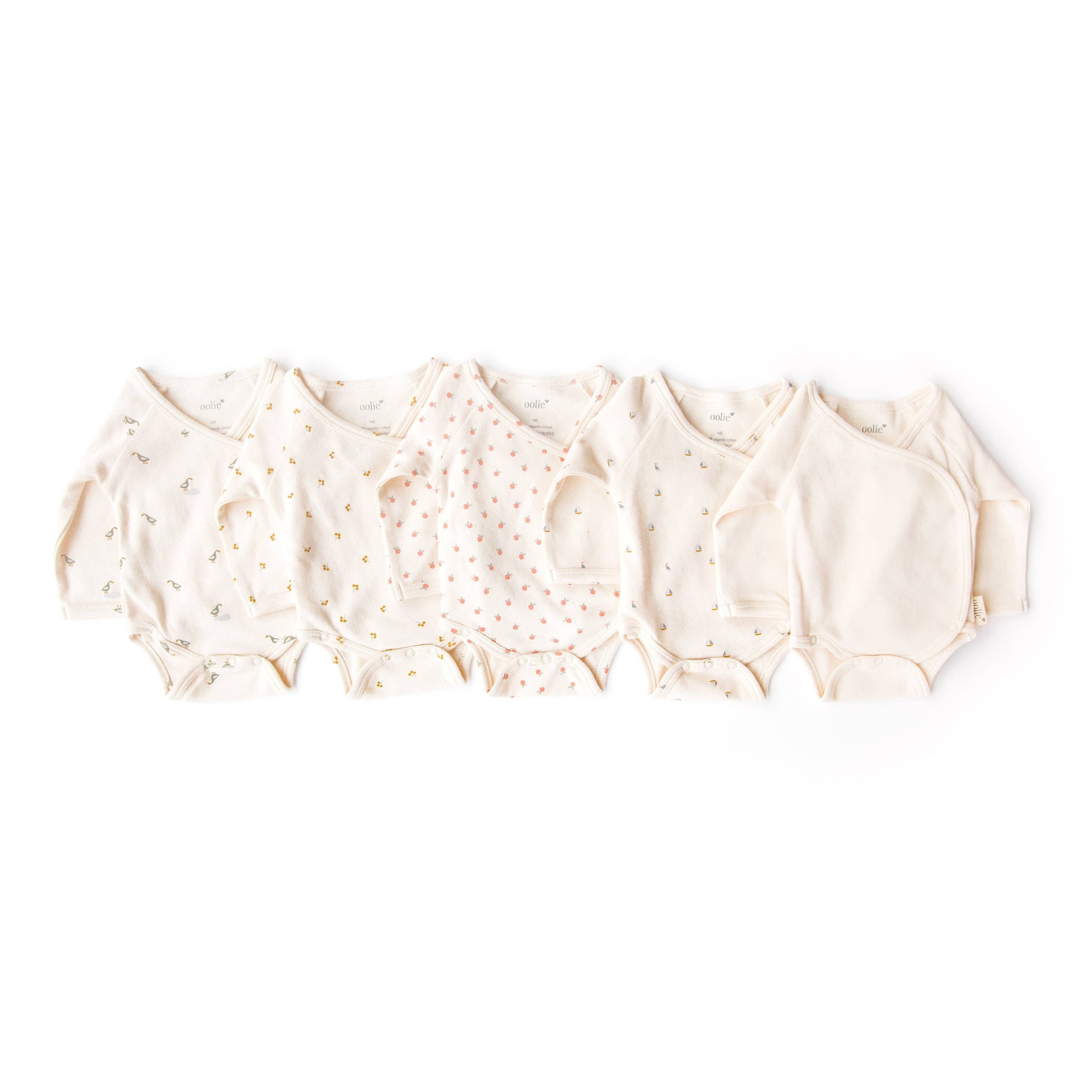 Beige baby rompers on a white background