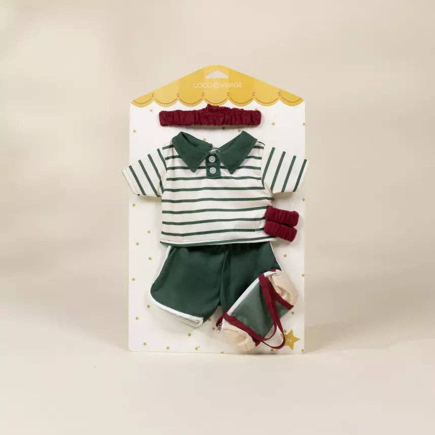 Packaged doll outfit with striped shirt, shorts, and red accents on a beige background