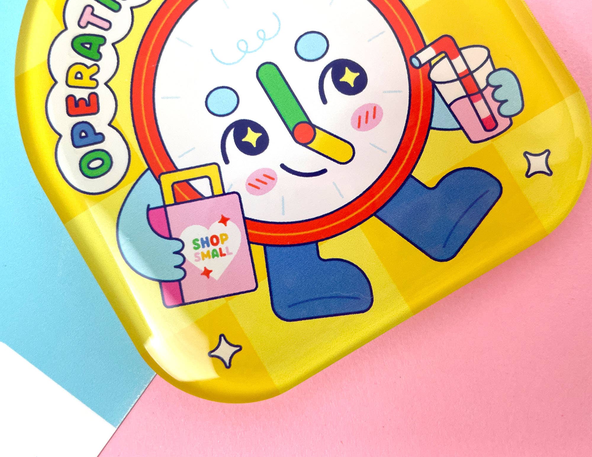 Colorful toy with cartoon character on a pink and blue background