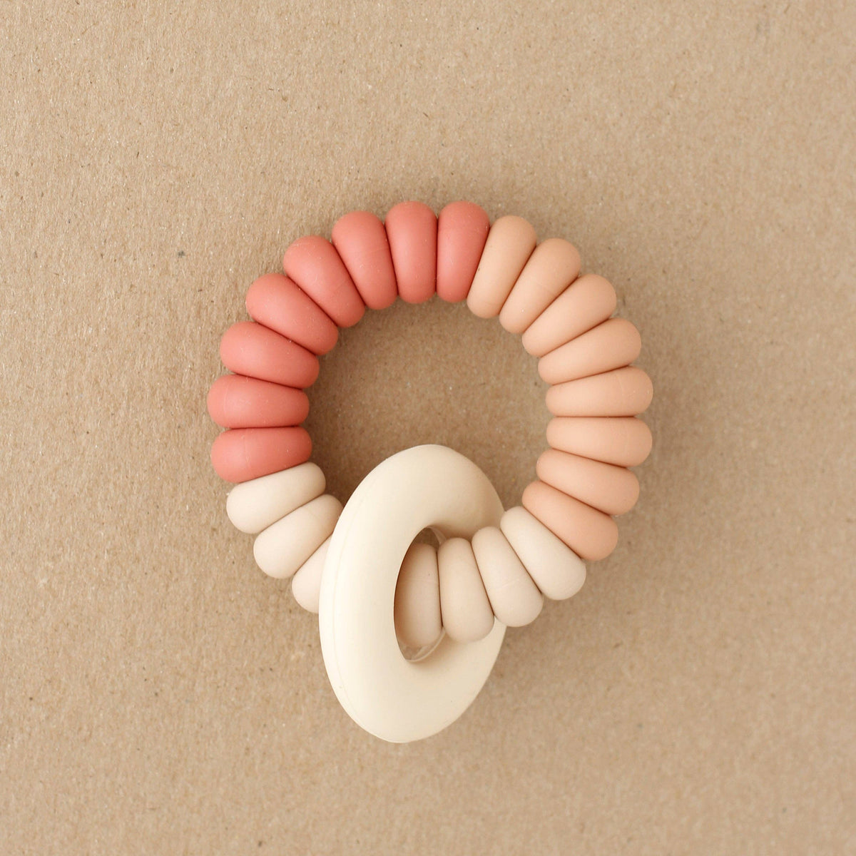 Colorful rubber band set on a beige background