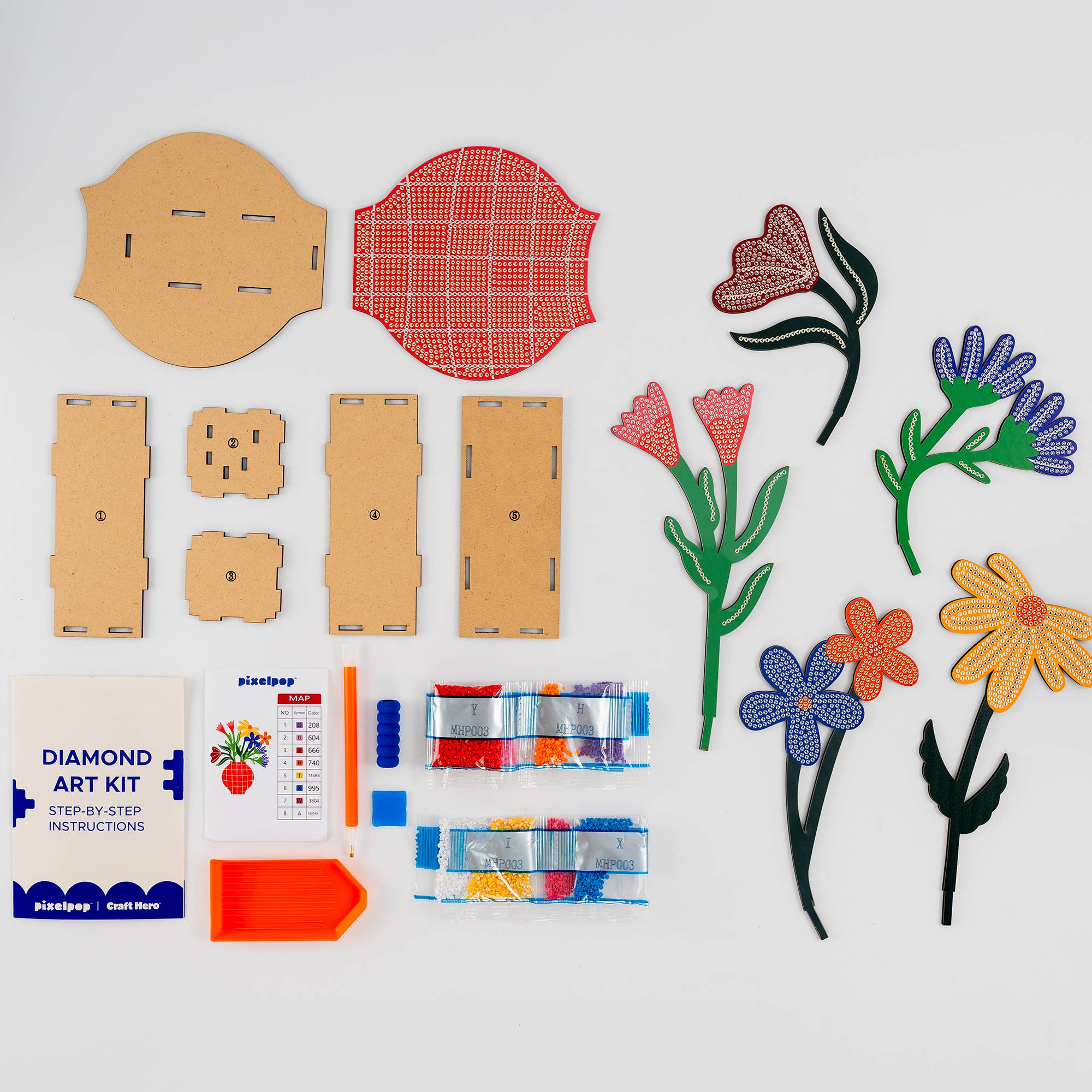 Diamond art kit with cardboard pieces and colored diamonds on a white background