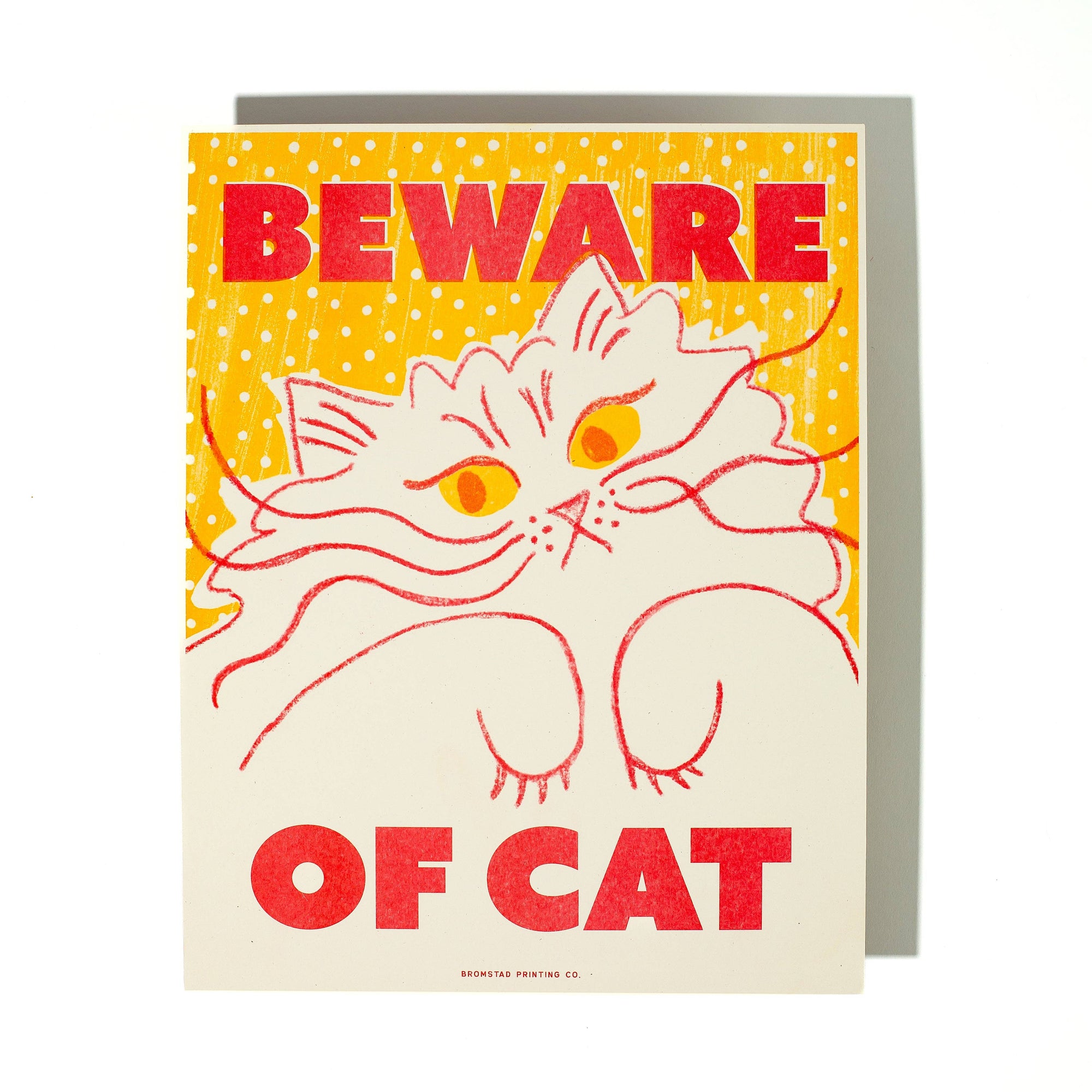 Greeting card with a cat illustration and 'Beware of Cat' text on a yellow and white background