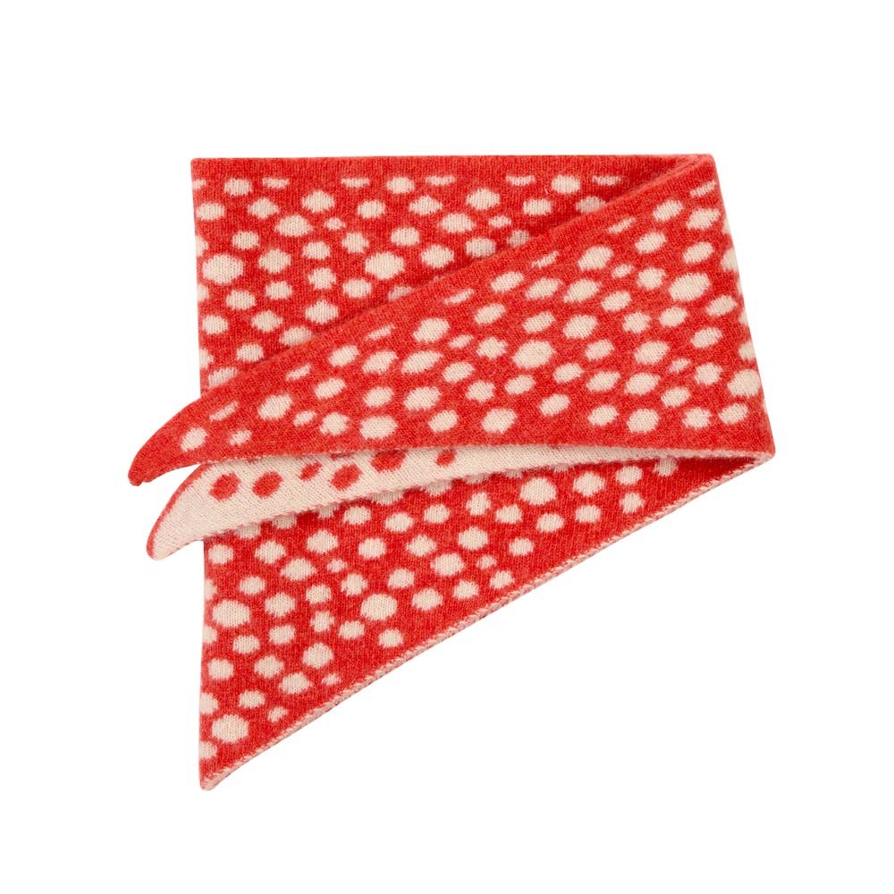 Red fabric with white polka dots on a white background