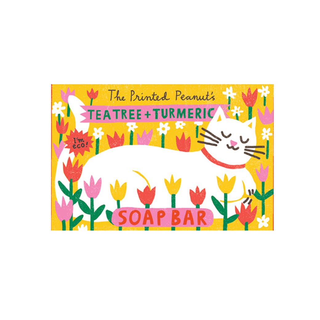 Soap bar packaging with a cat illustration and floral design on a yellow background