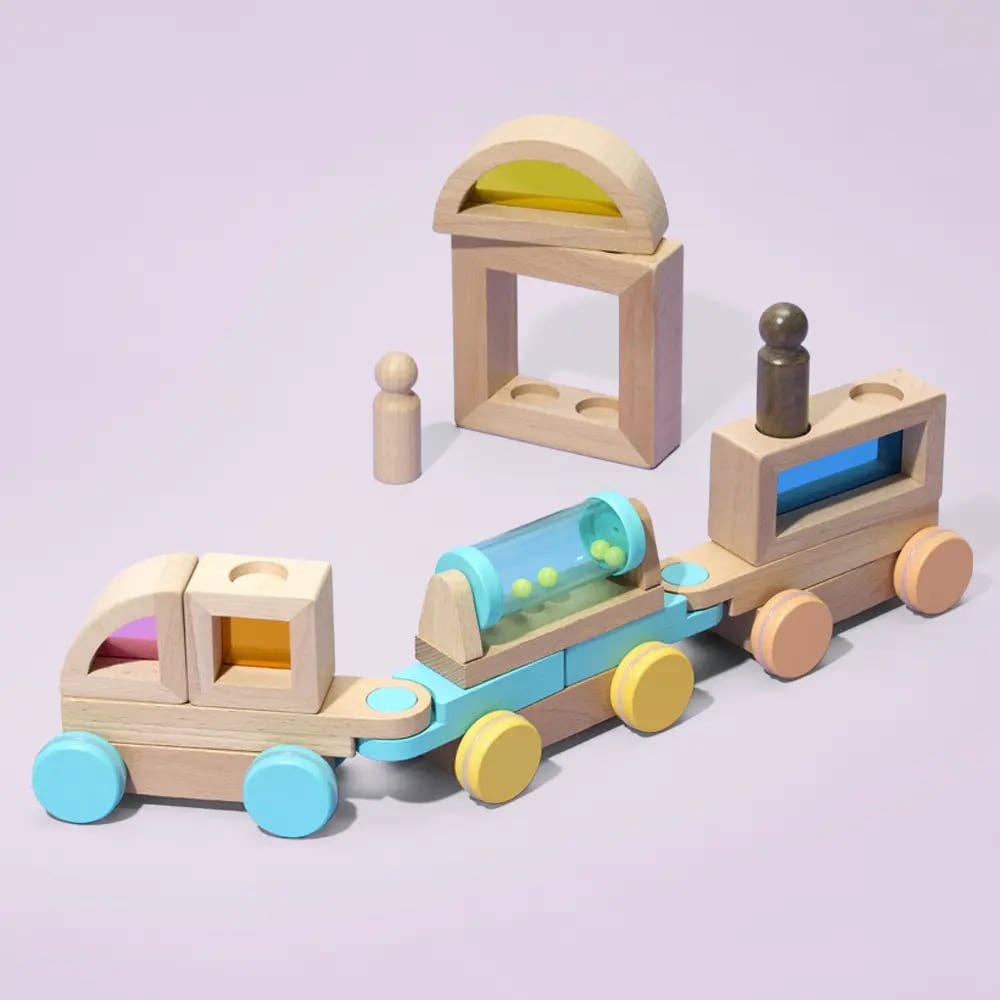 Wooden toy train set on a light purple background