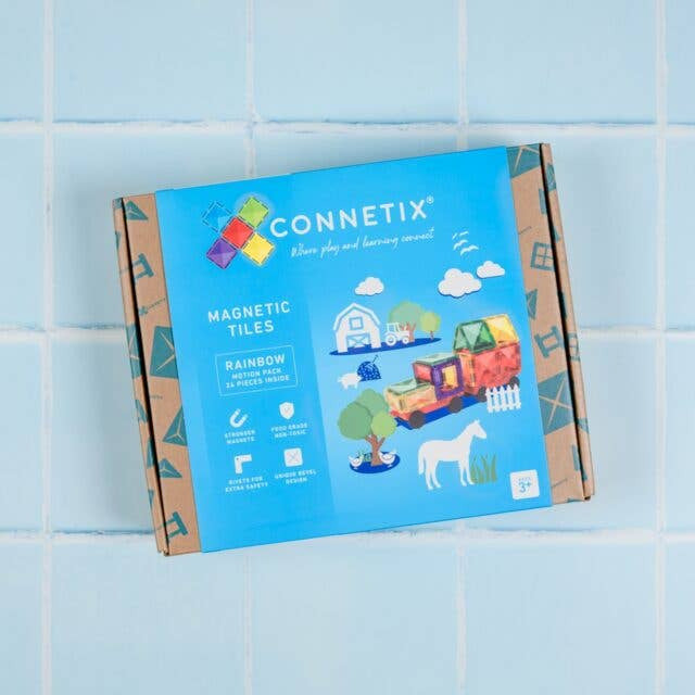 Connetix magnetic tiles packaging on a blue tiled wall