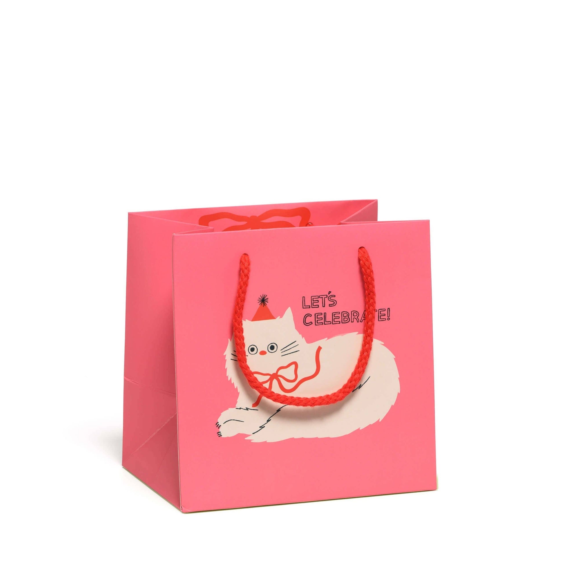 Pink gift bag with a cat illustration and 'Let's Celebrate!' text on a white background